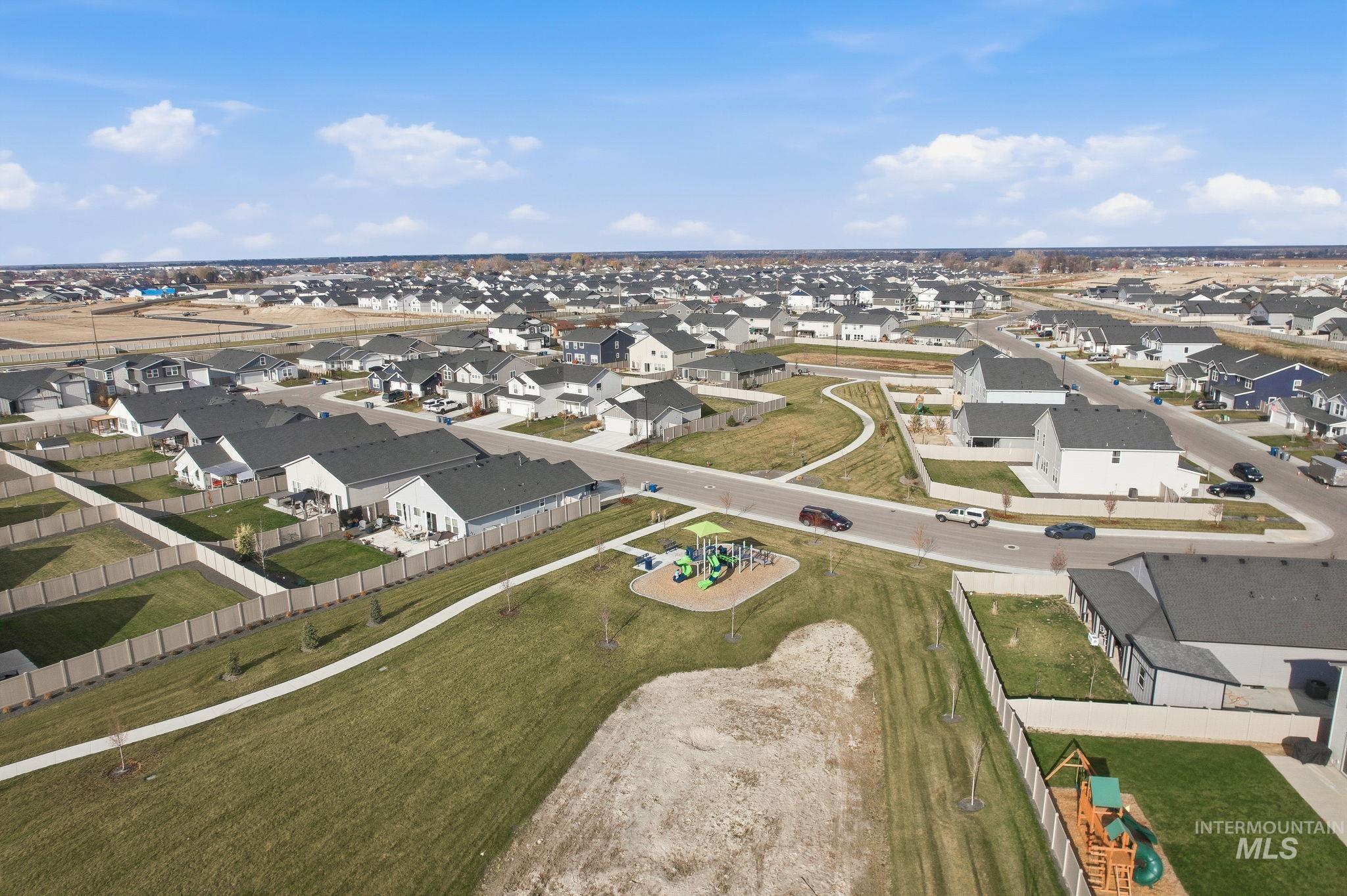 Aerial overview of property's location featuring nearby suburban area