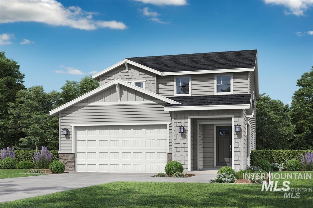 View of front of home featuring driveway, a shingled roof, stone siding, and a front lawn