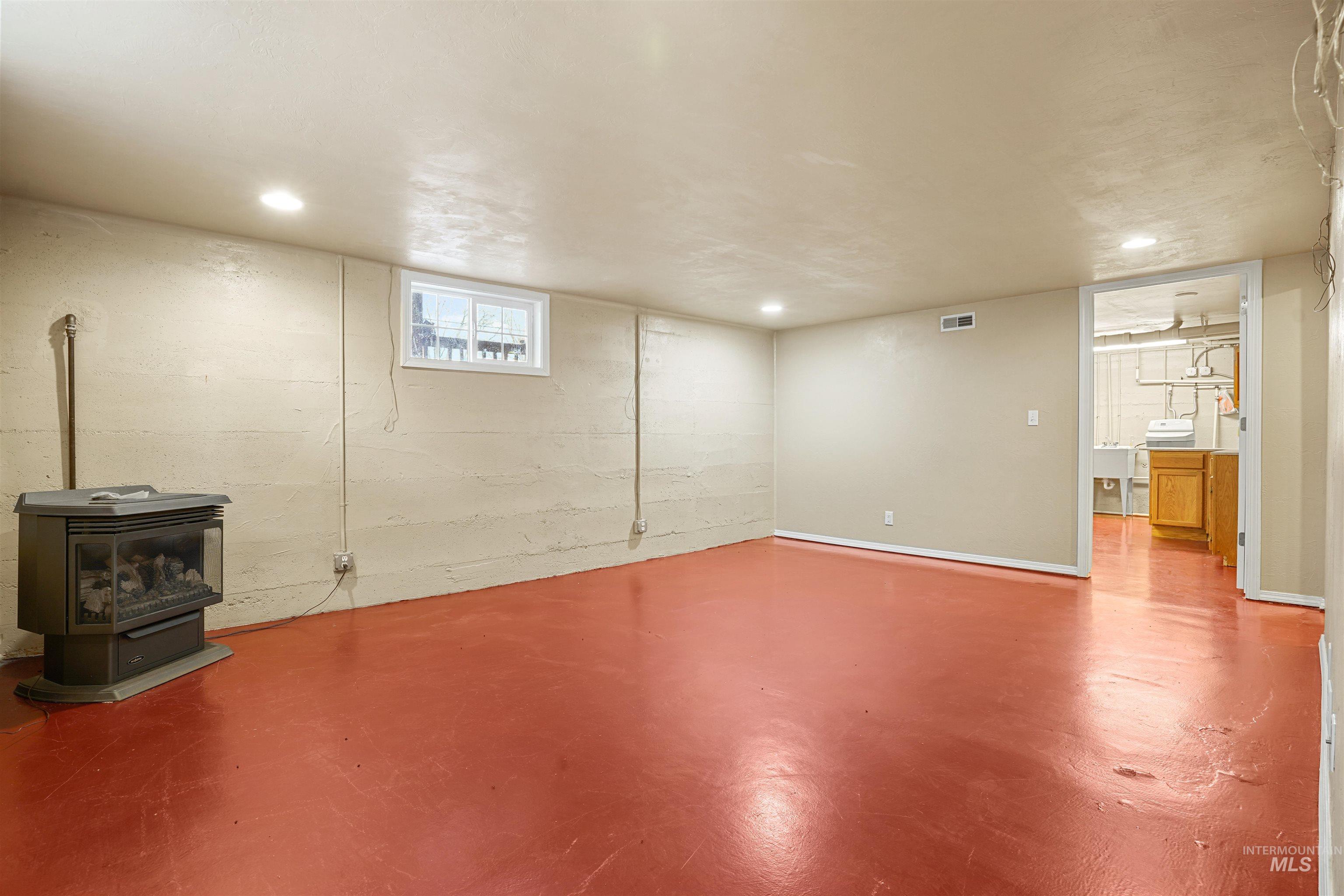 Basement featuring a wood stove