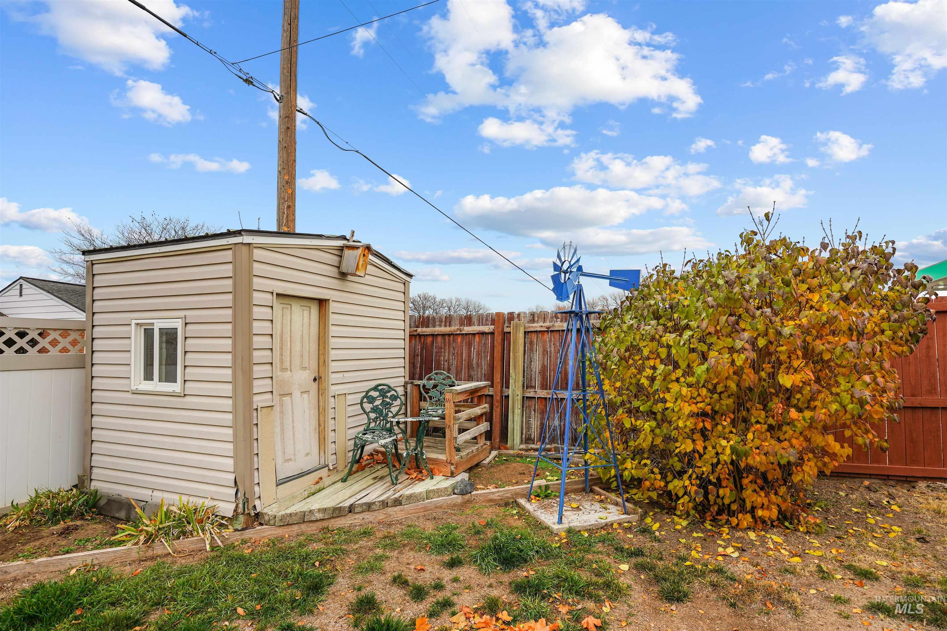 View of shed featuring a fenced backyard