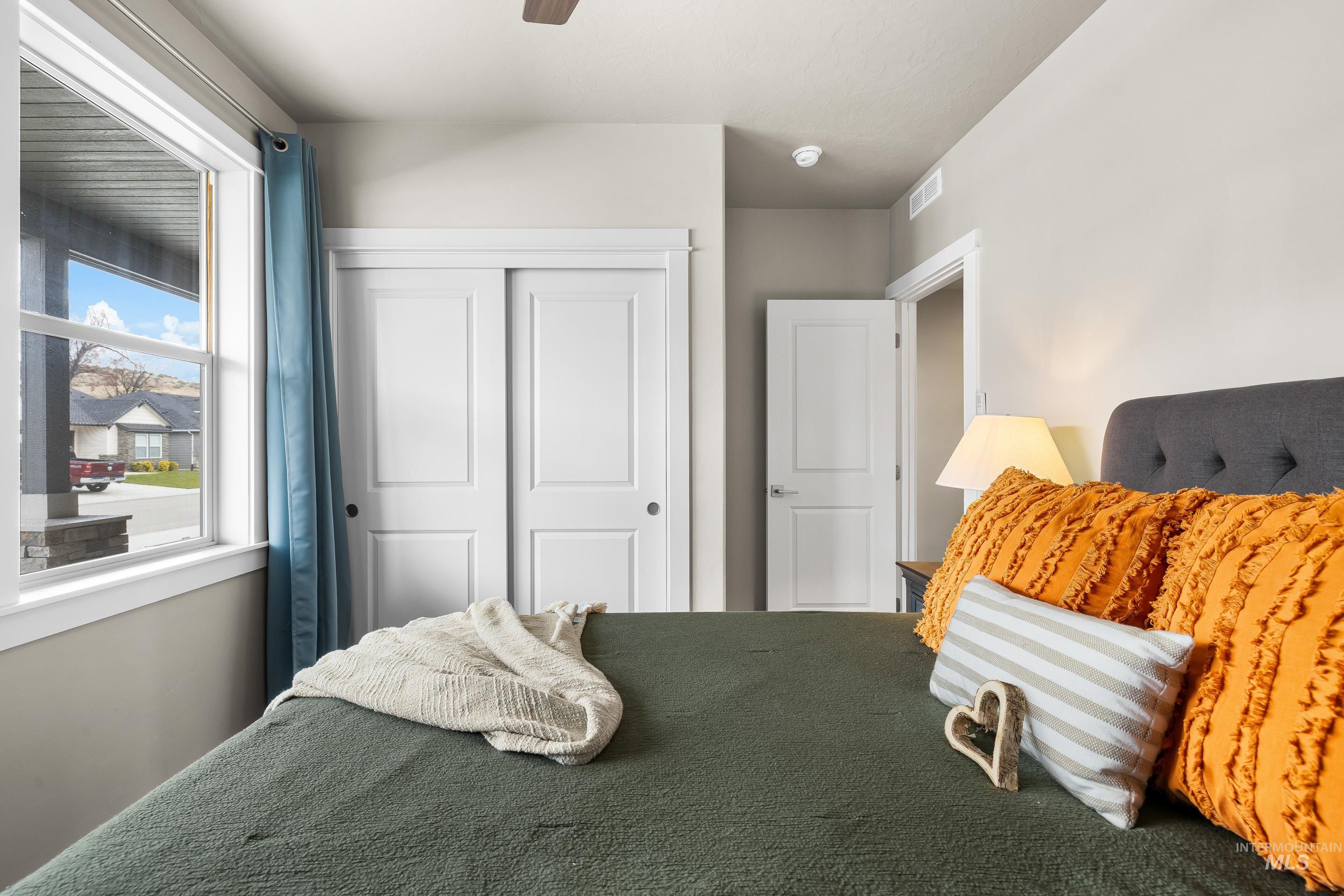 Bedroom featuring a closet and ceiling fan