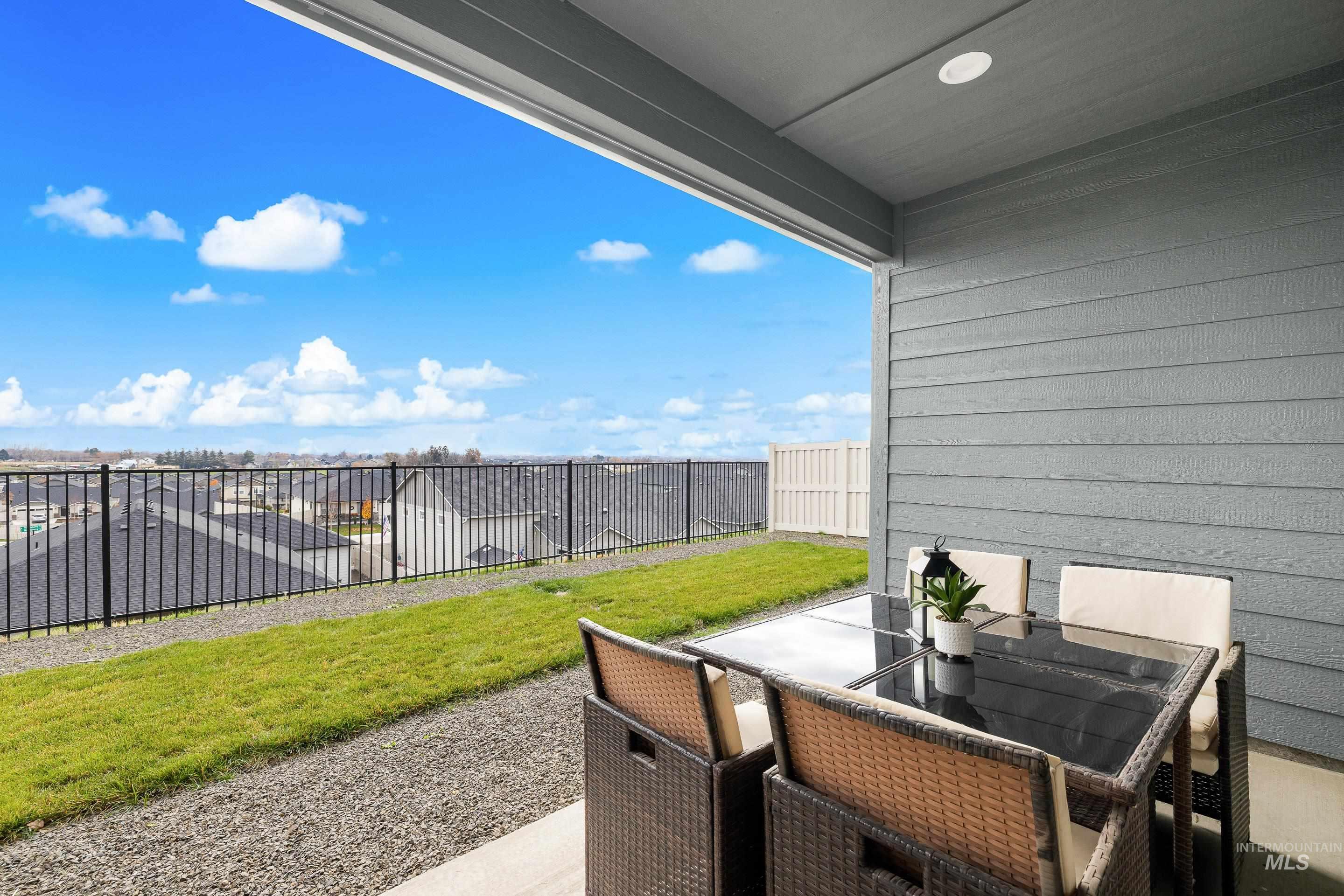 Fenced backyard featuring a patio area and outdoor dining space