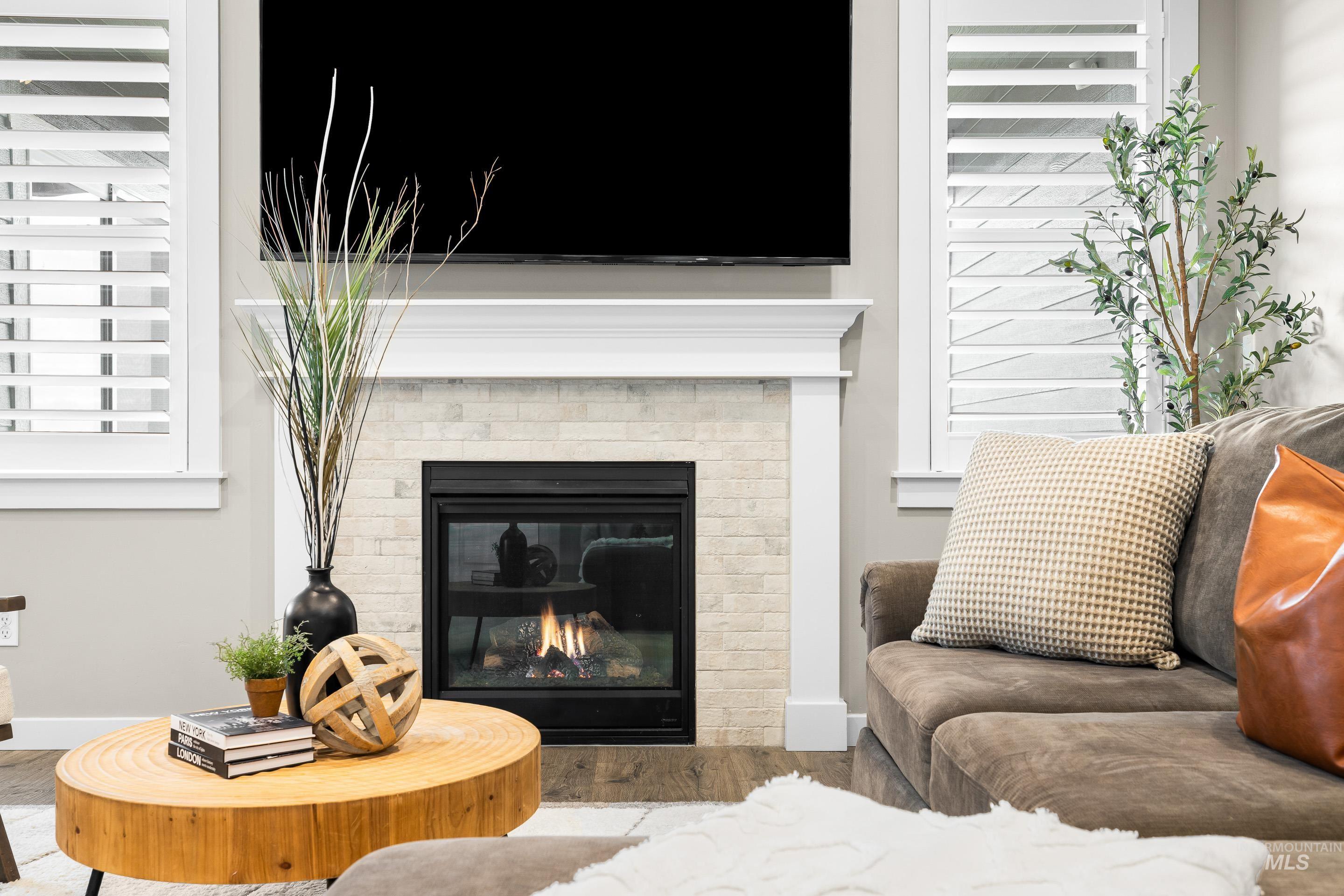 Living area featuring wood finished floors and a fireplace