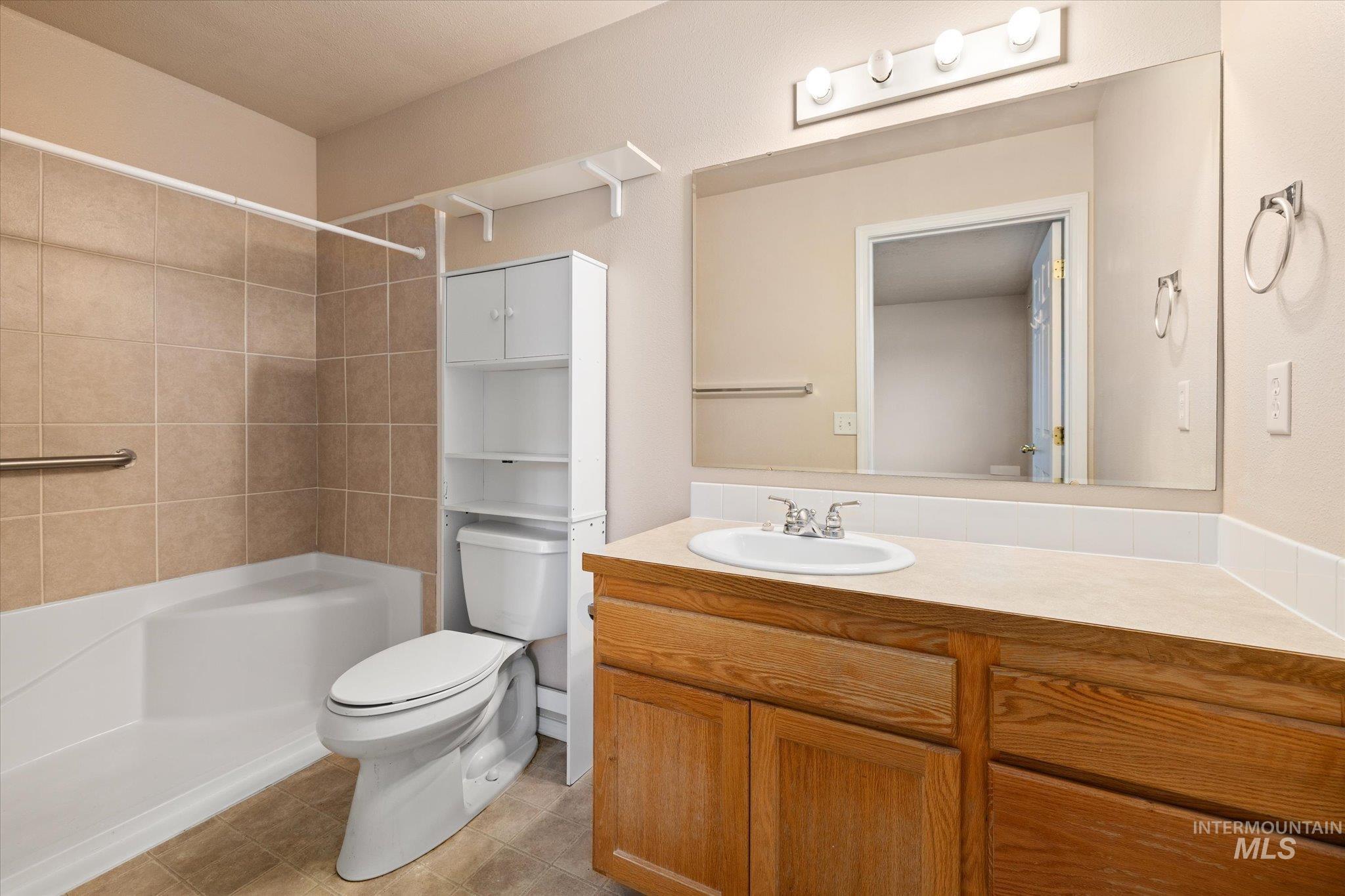 Bathroom featuring vanity and light tile patterned floors