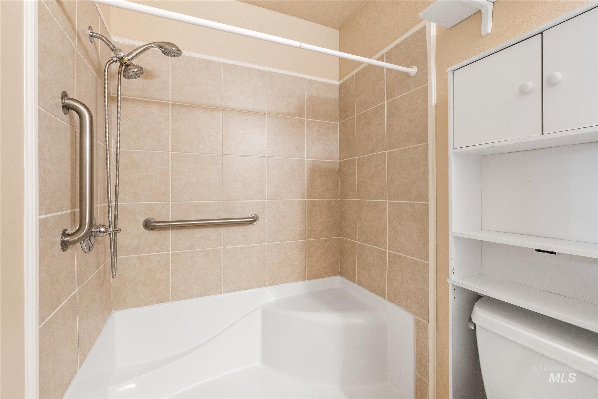 Bathroom with a walk-in shower.