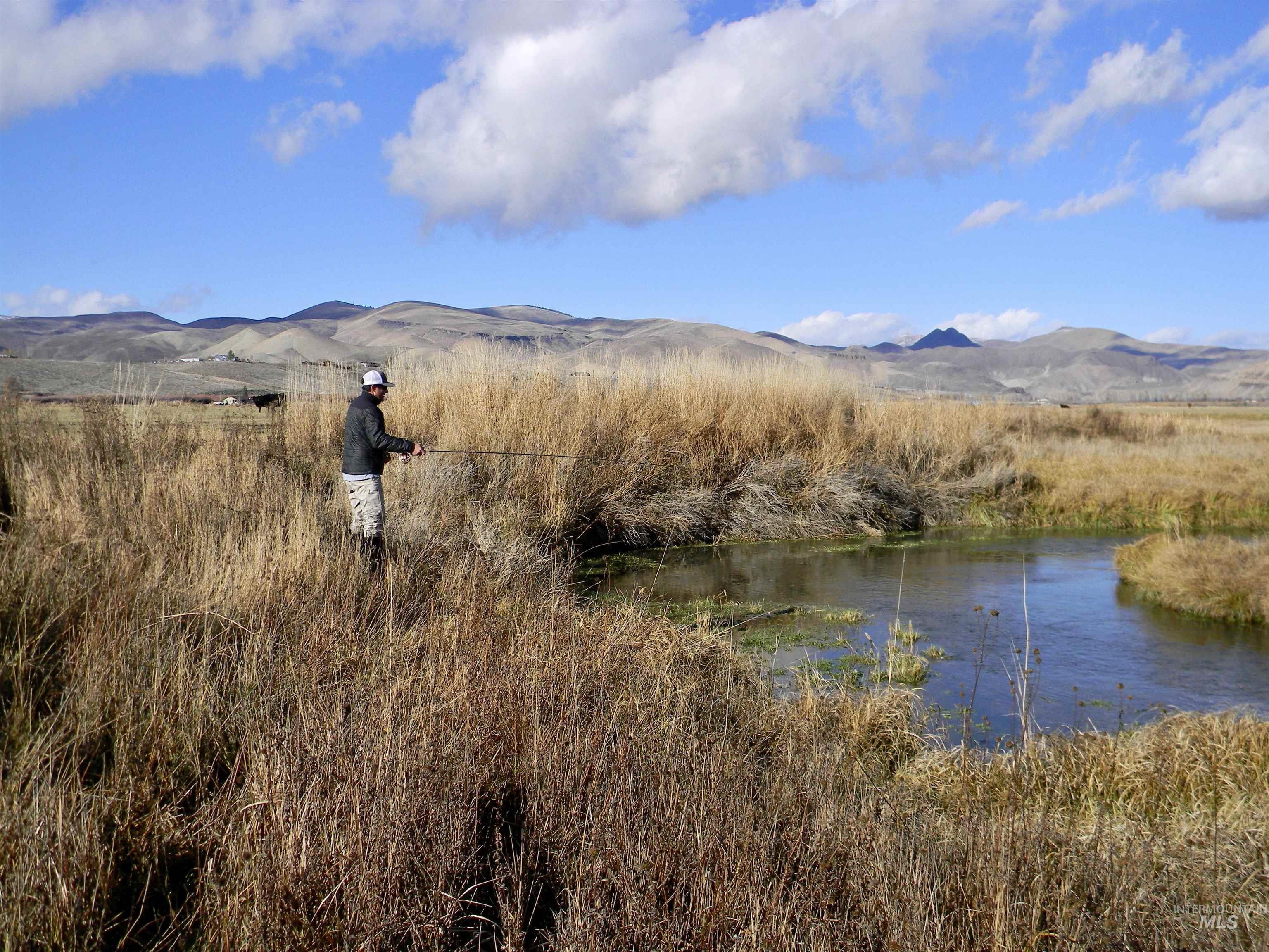 View of mountain backdrop featuring a large body of water