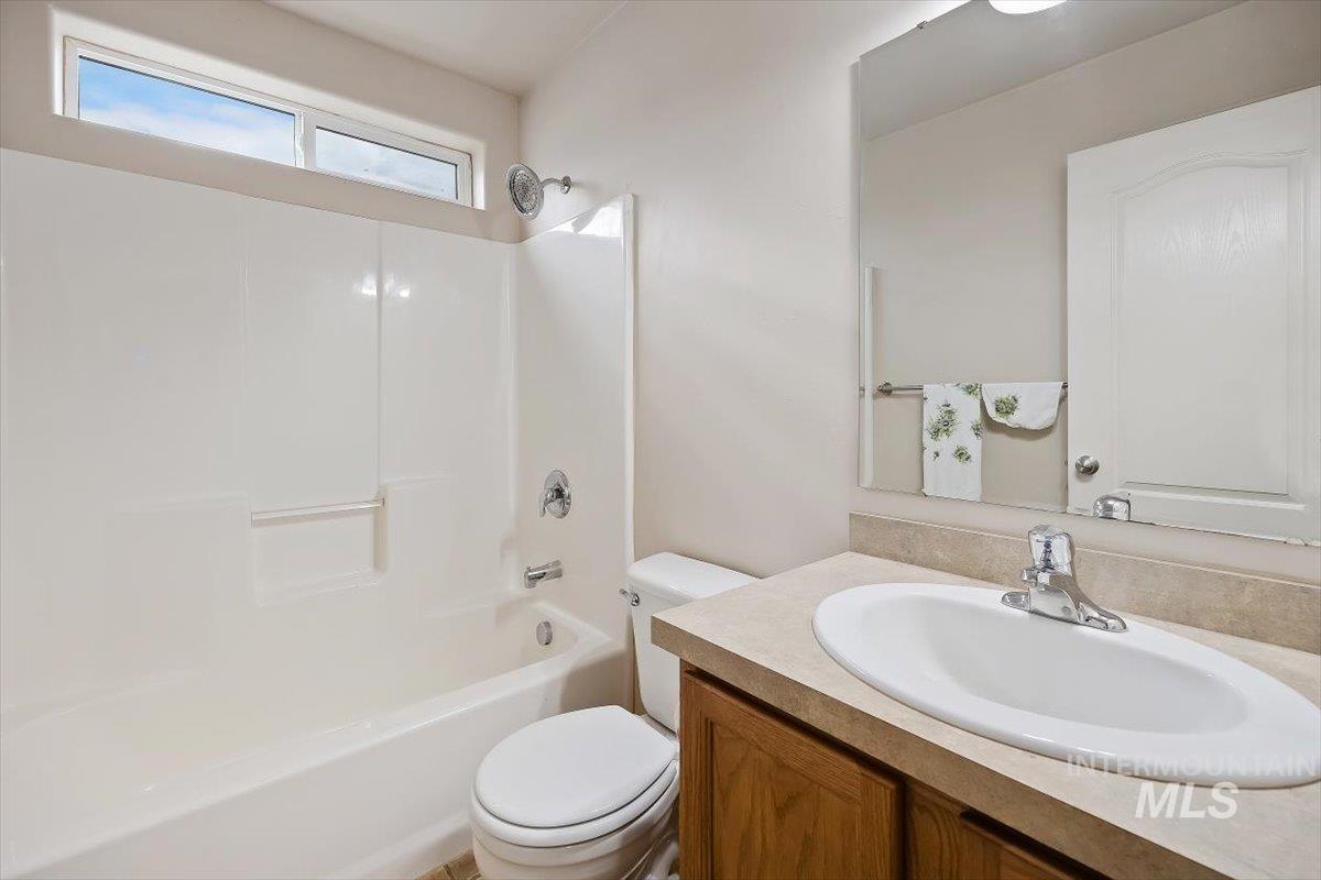 Bathroom with vanity and shower / bathtub combination