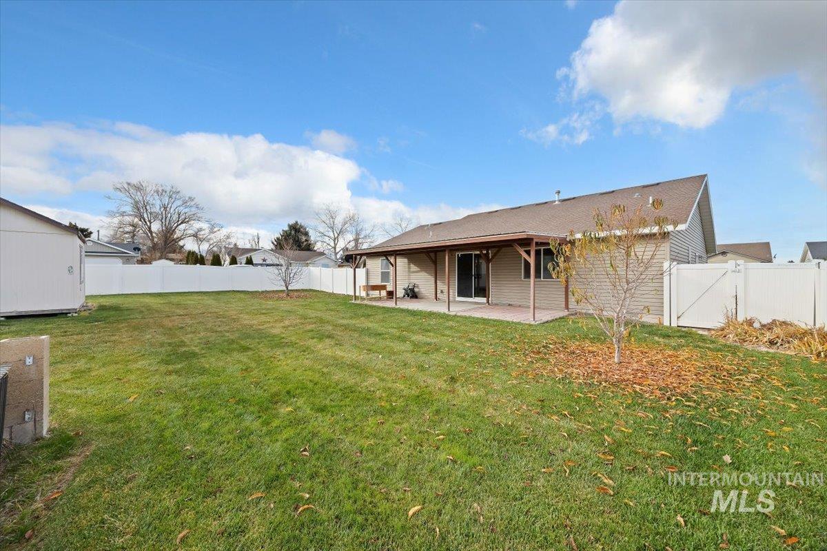 Back of house featuring a patio area and a fenced backyard