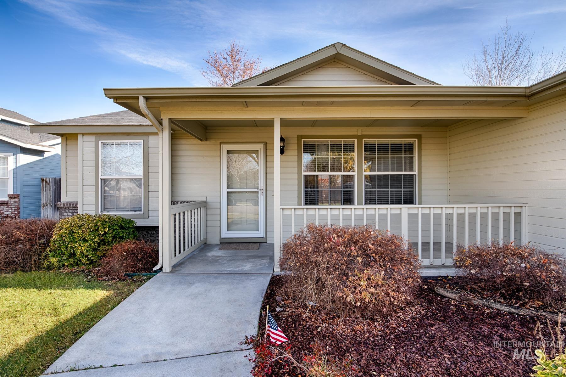 Entrance to property featuring covered porch