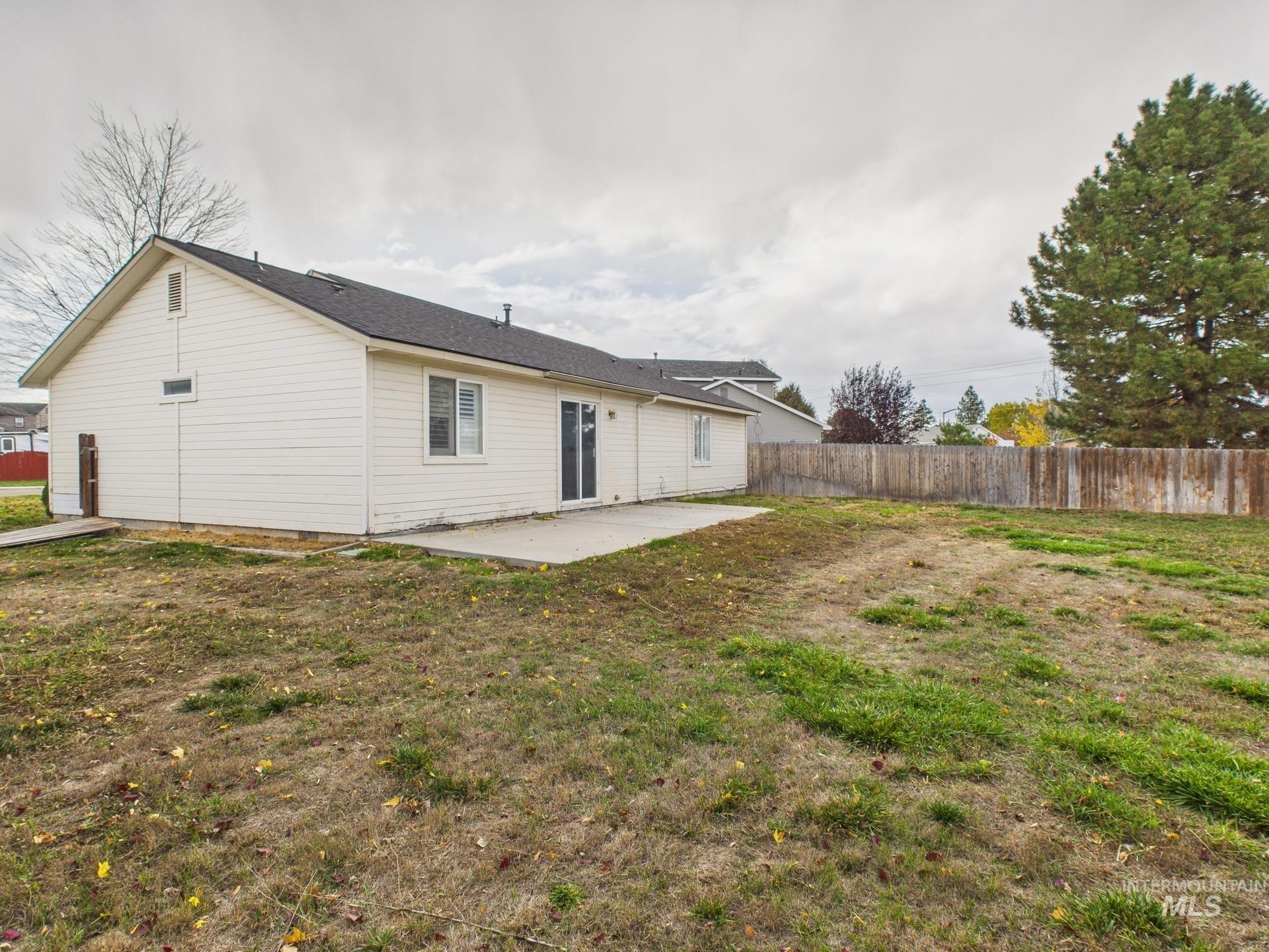 Rear view of house featuring a patio area