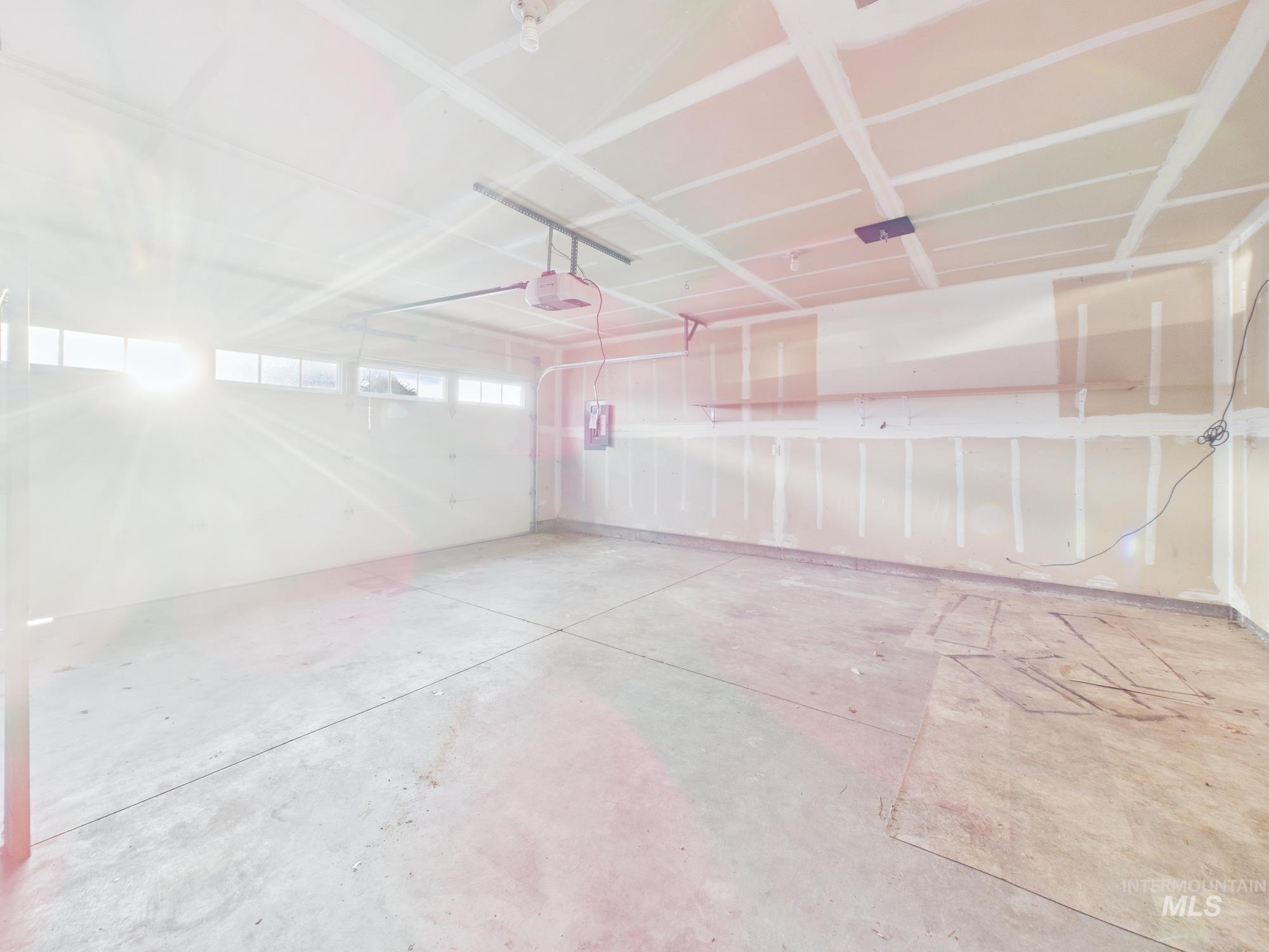 Garage featuring a garage door opener