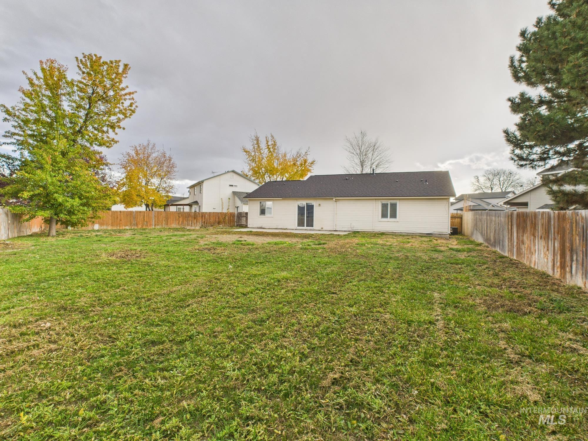 Back of house featuring a fenced backyard