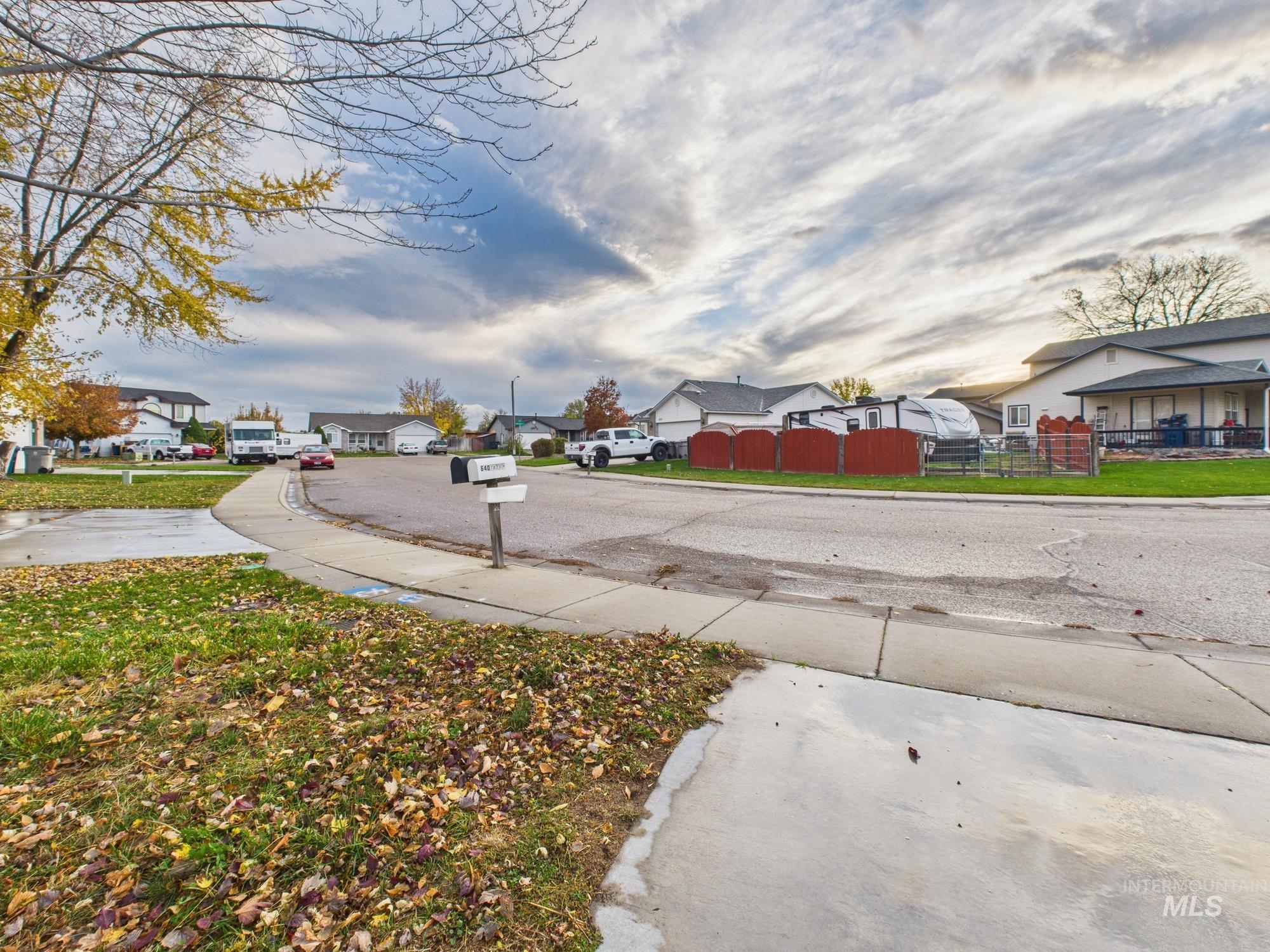 View of road featuring a residential view, sidewalks, and curbs