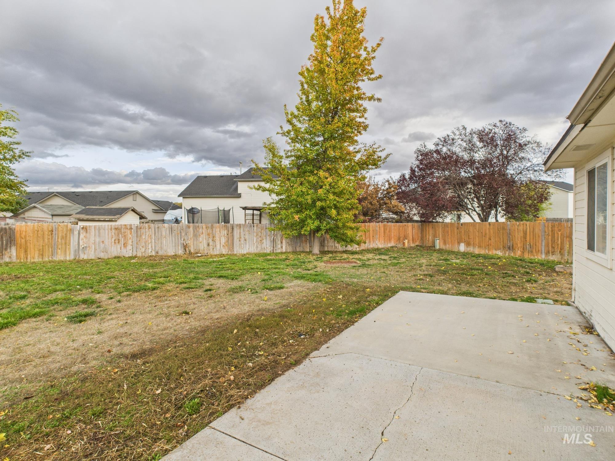 Fenced backyard featuring a patio area