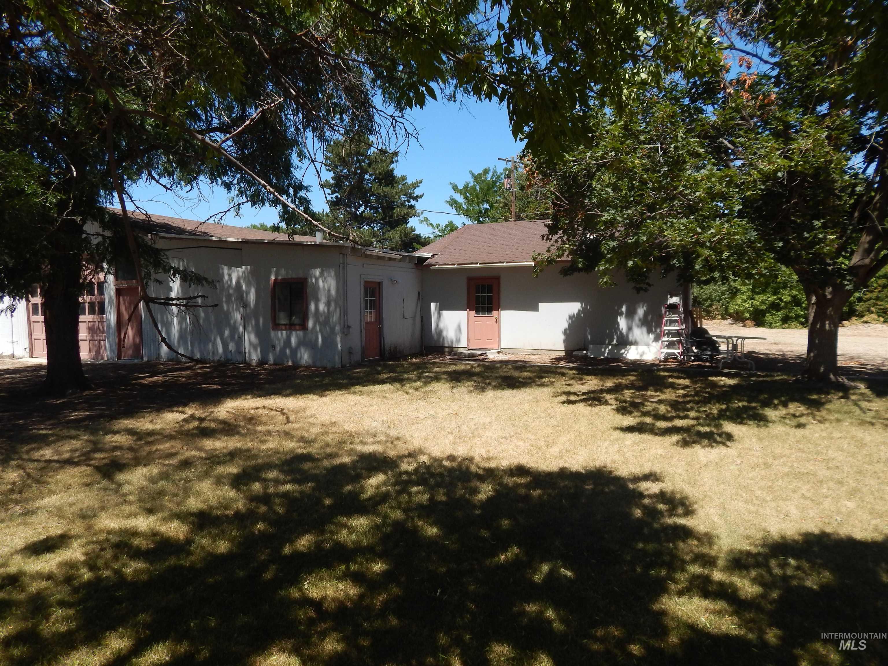 Back of house featuring a yard