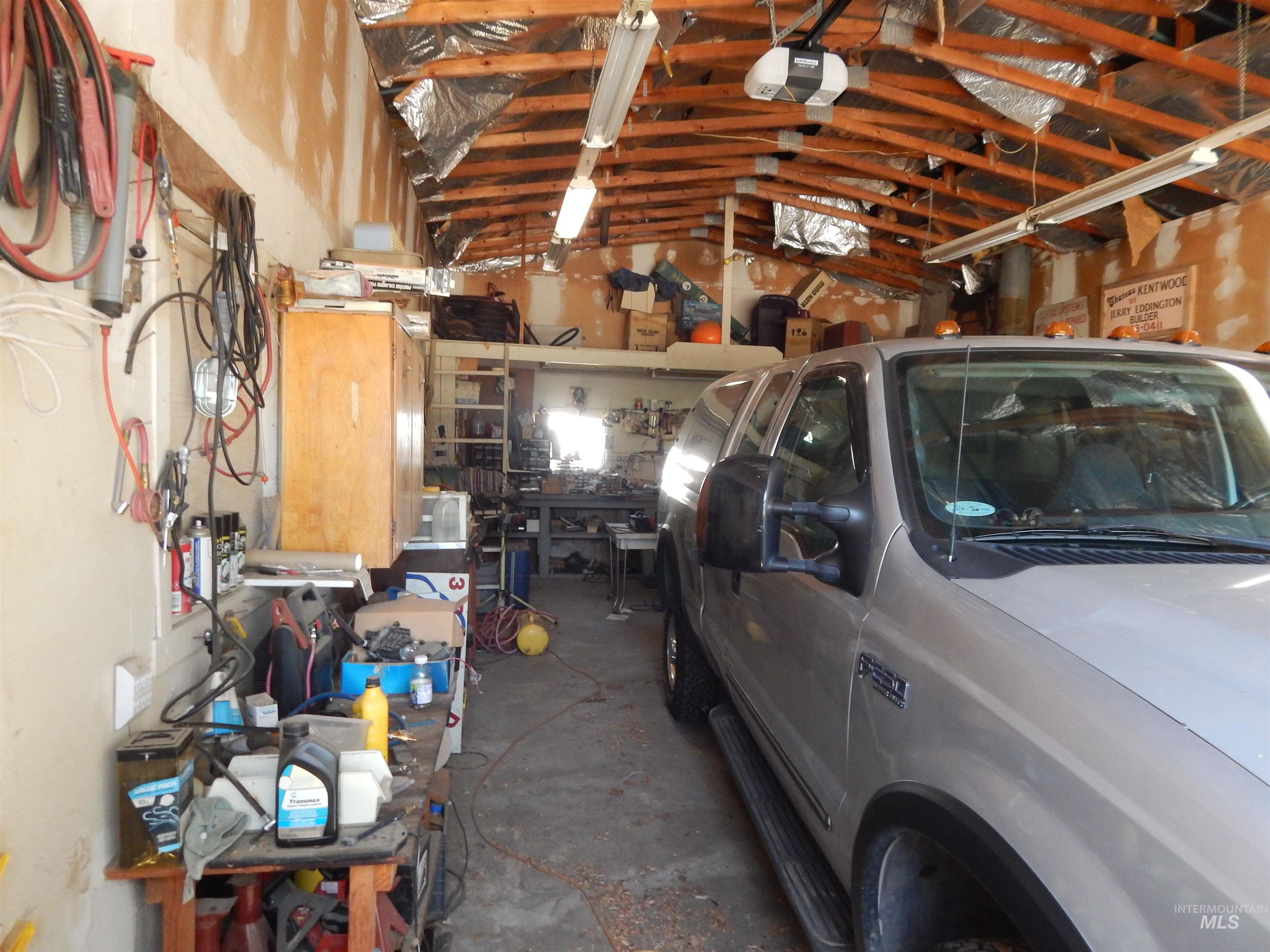 Garage with washer / dryer and a garage door opener