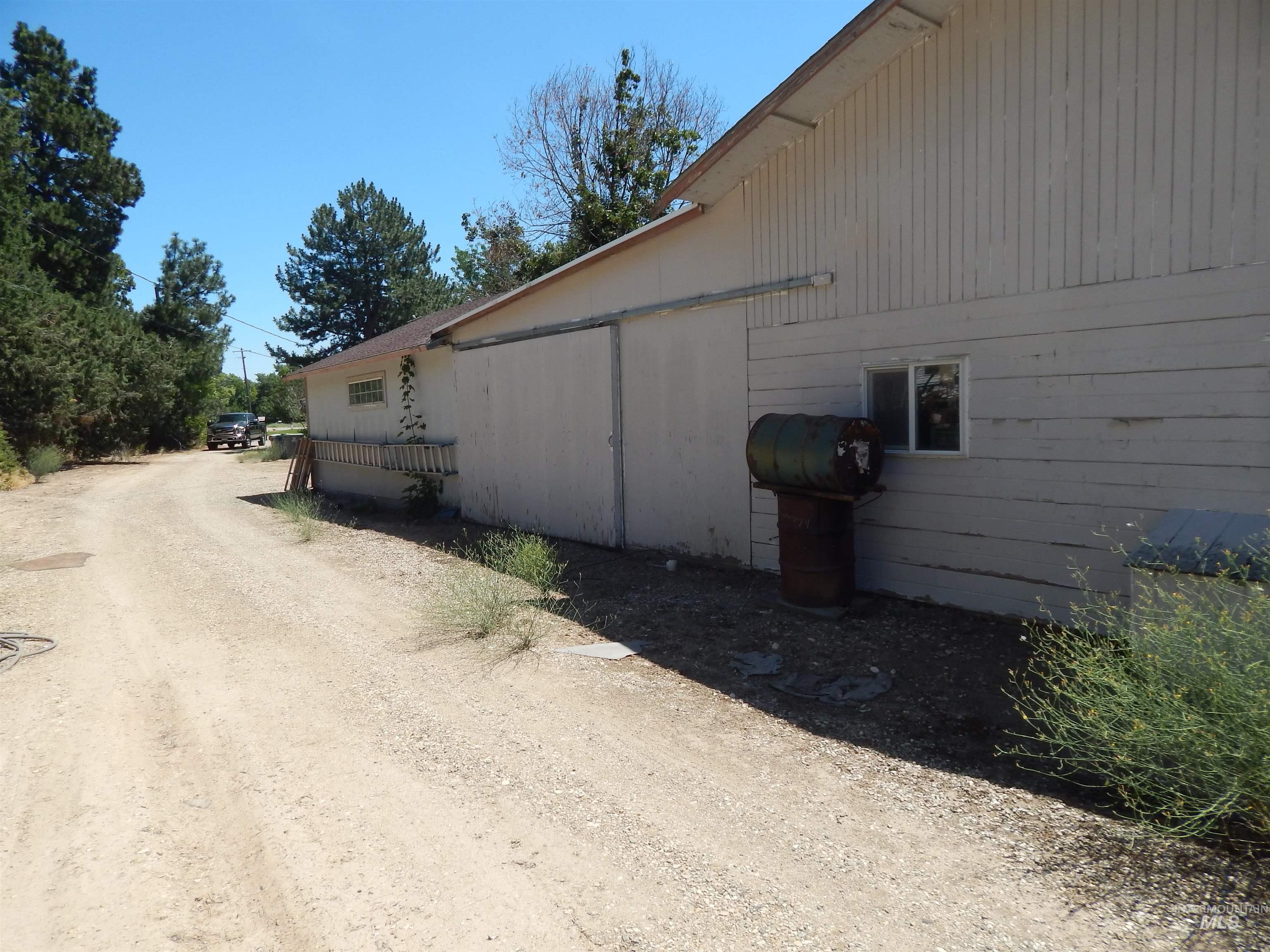 View of side of property featuring driveway