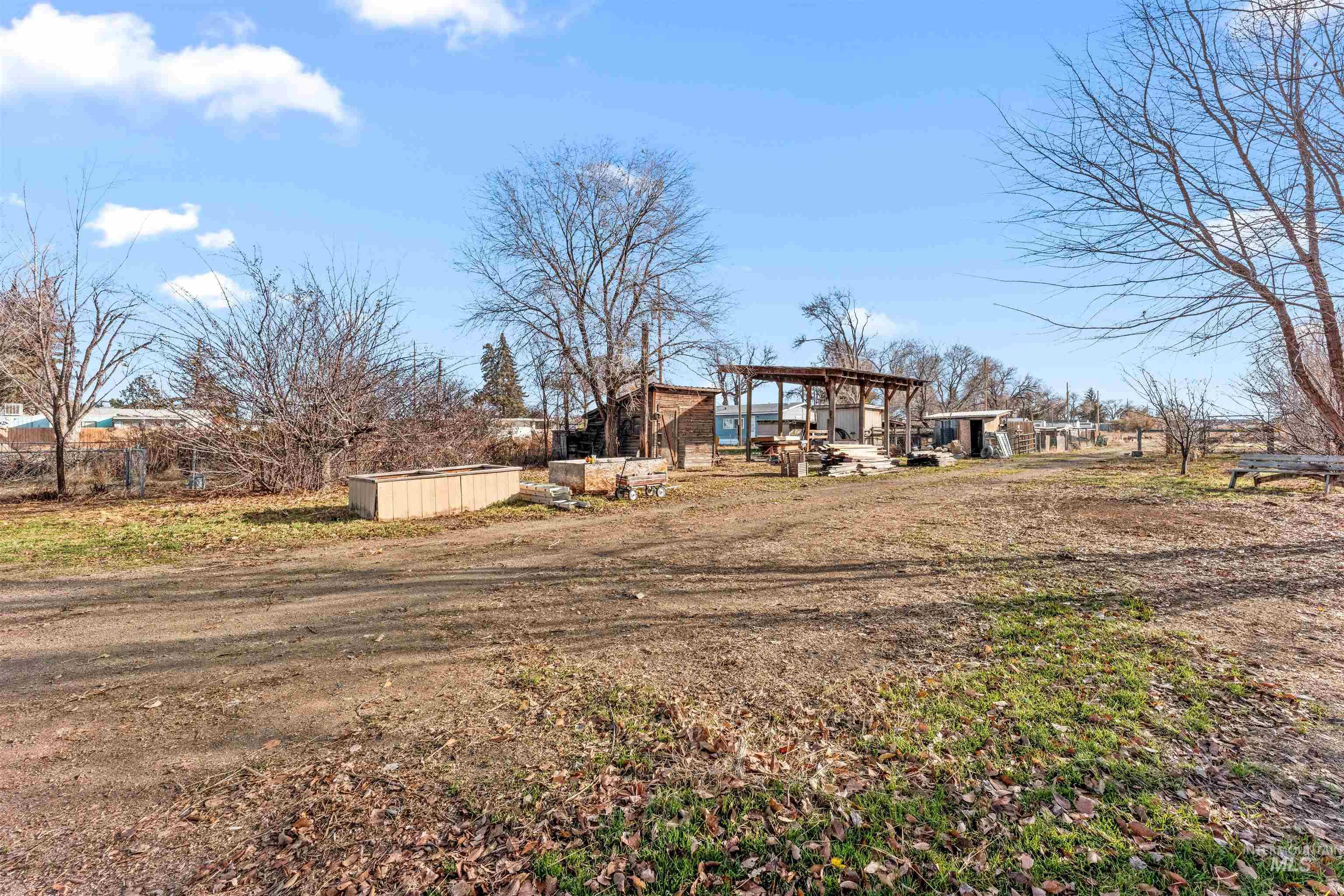 View of yard with a gazebo, an outbuilding, and a patio area