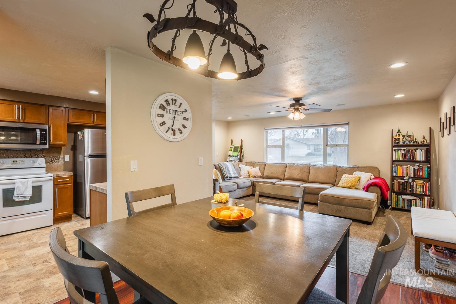 Dining room featuring recessed lighting, ceiling fan, and a textured ceiling