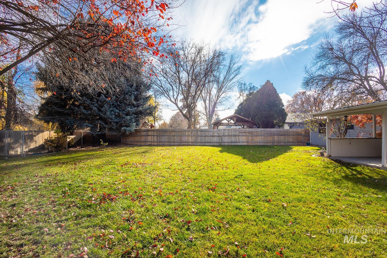 View of fenced backyard