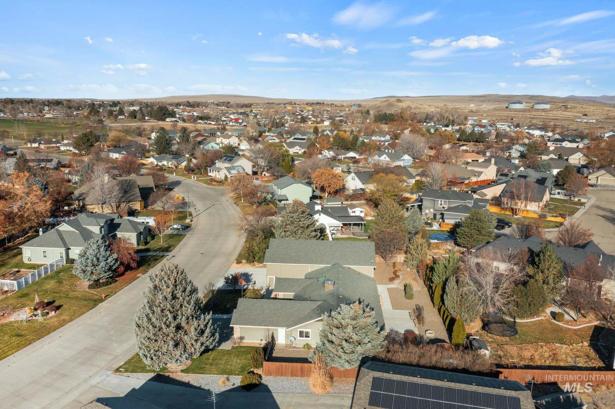 Aerial overview of property's location featuring nearby suburban area