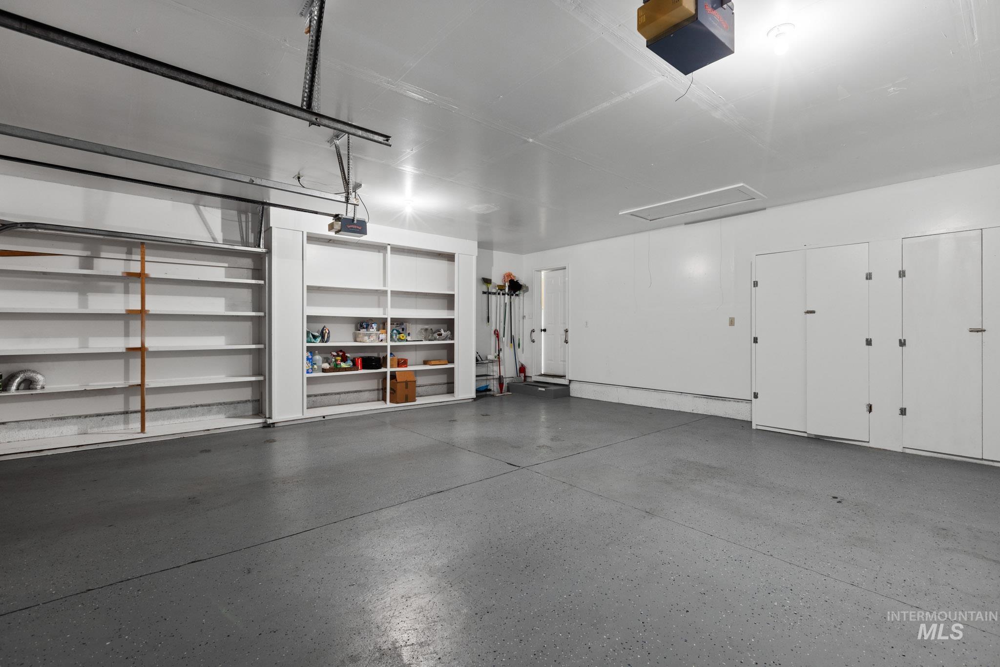 Garage featuring a garage door opener