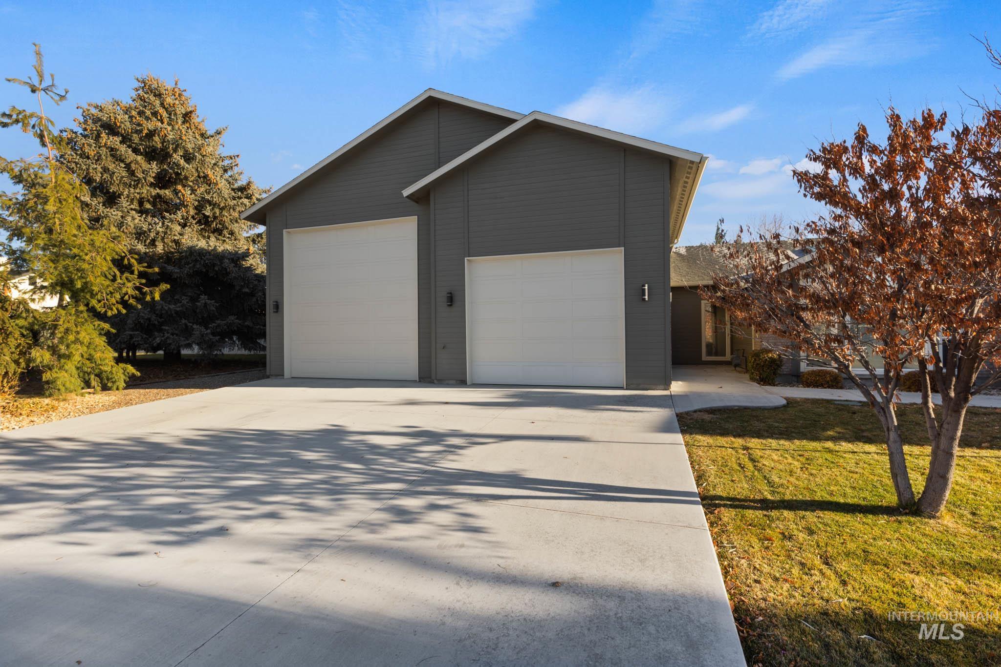 Garage with concrete driveway