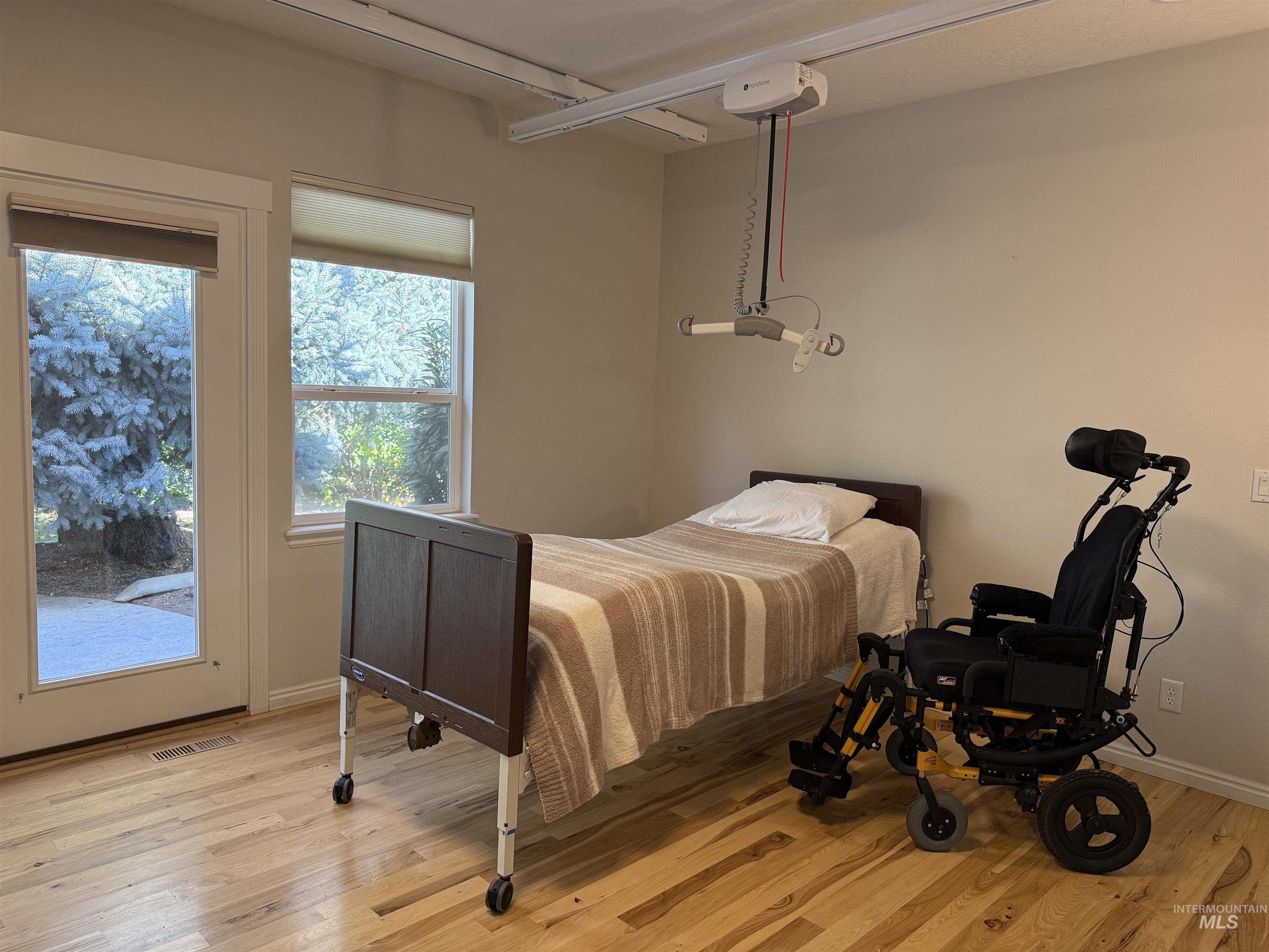 Bedroom featuring light wood-type flooring and access to outside