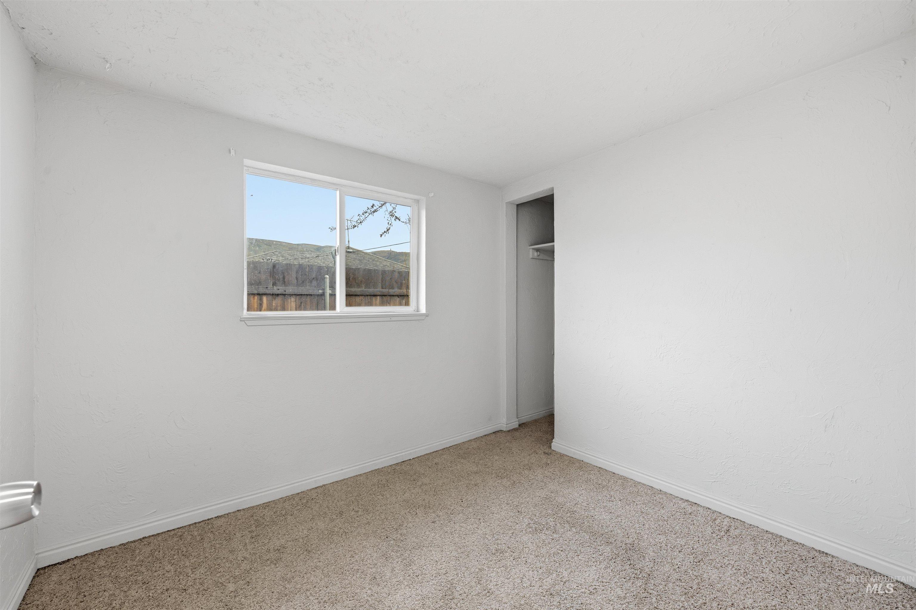 Unfurnished bedroom with a closet and carpet flooring