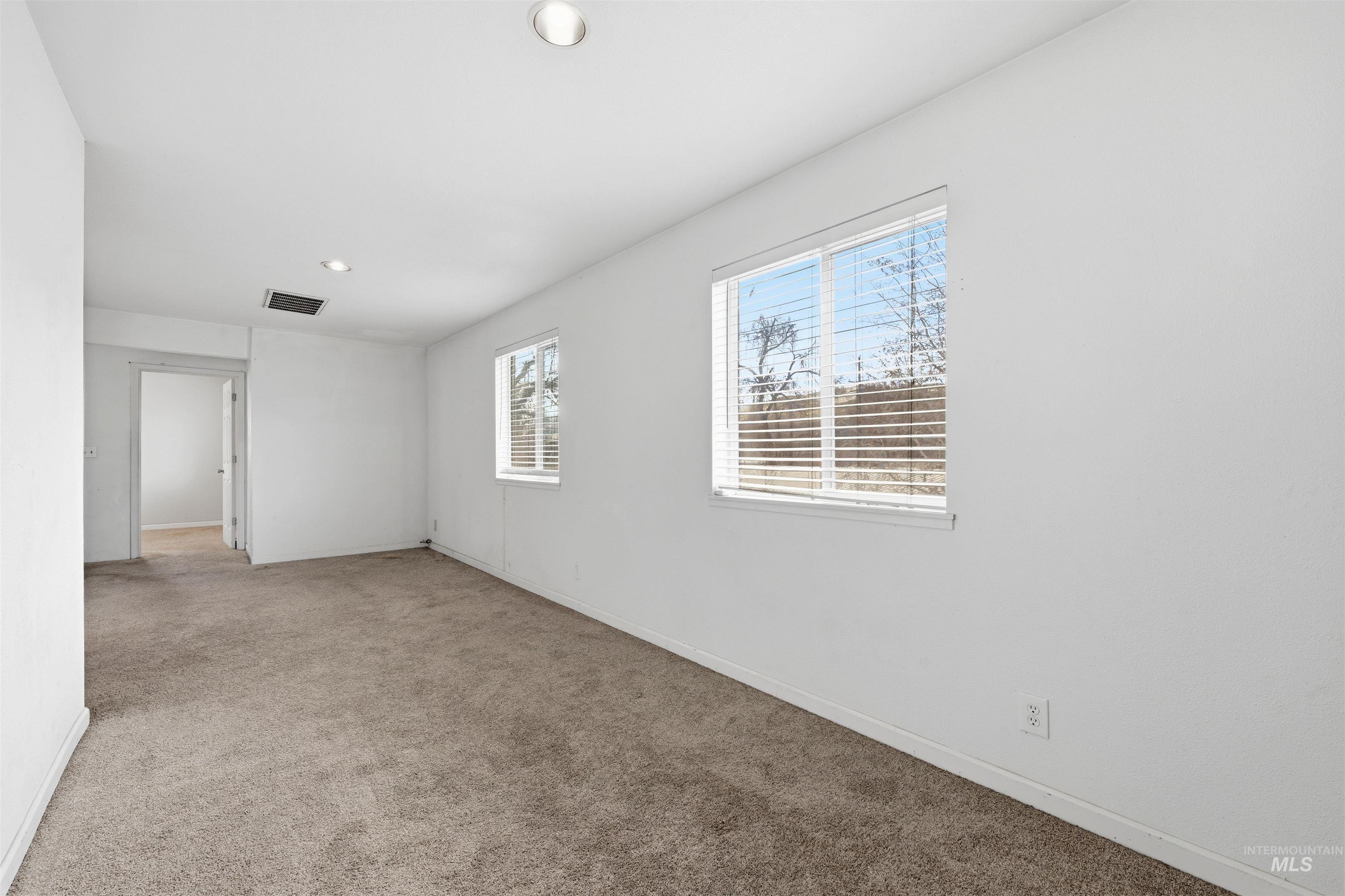Unfurnished room with carpet floors and recessed lighting