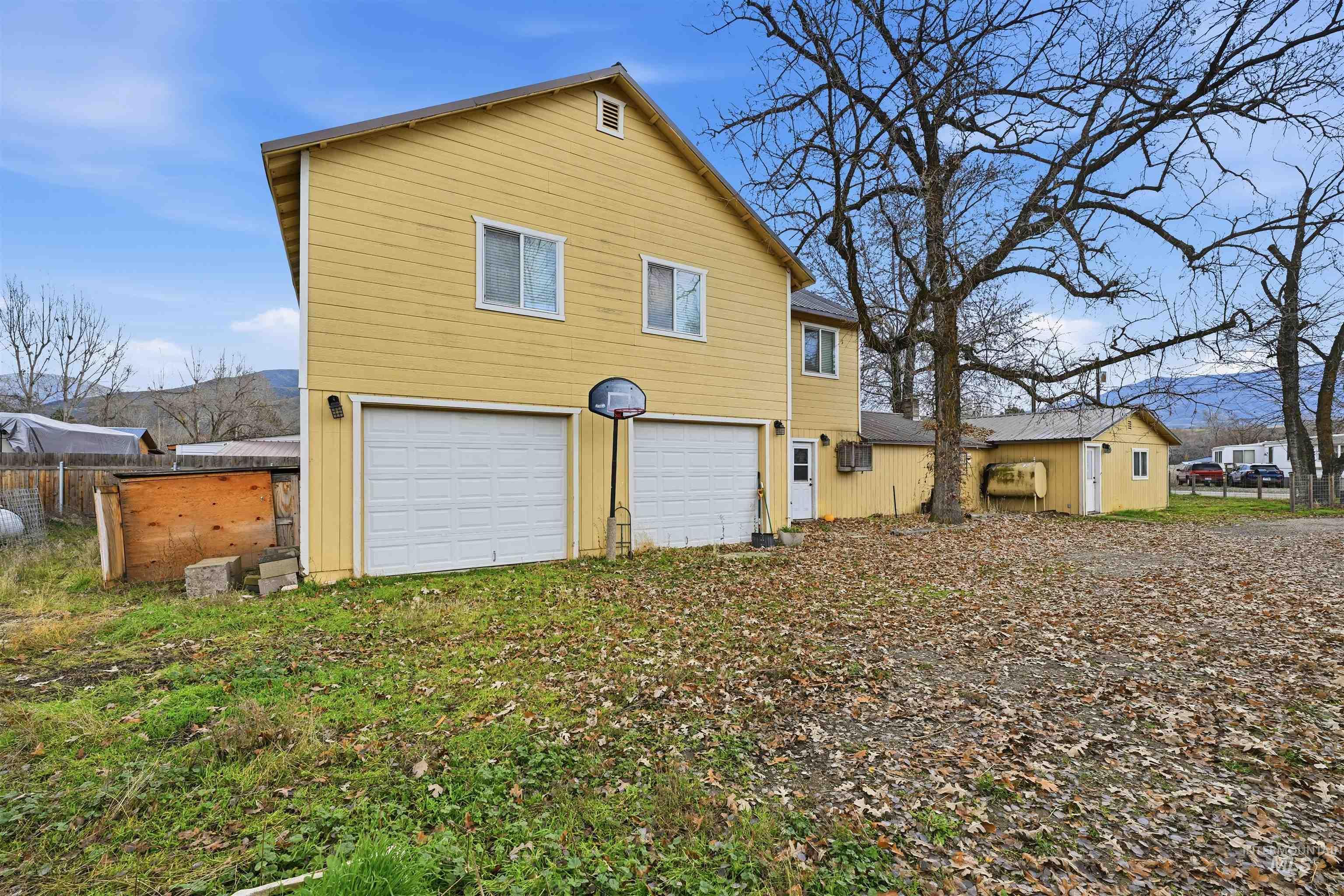 Back of property with an attached garage