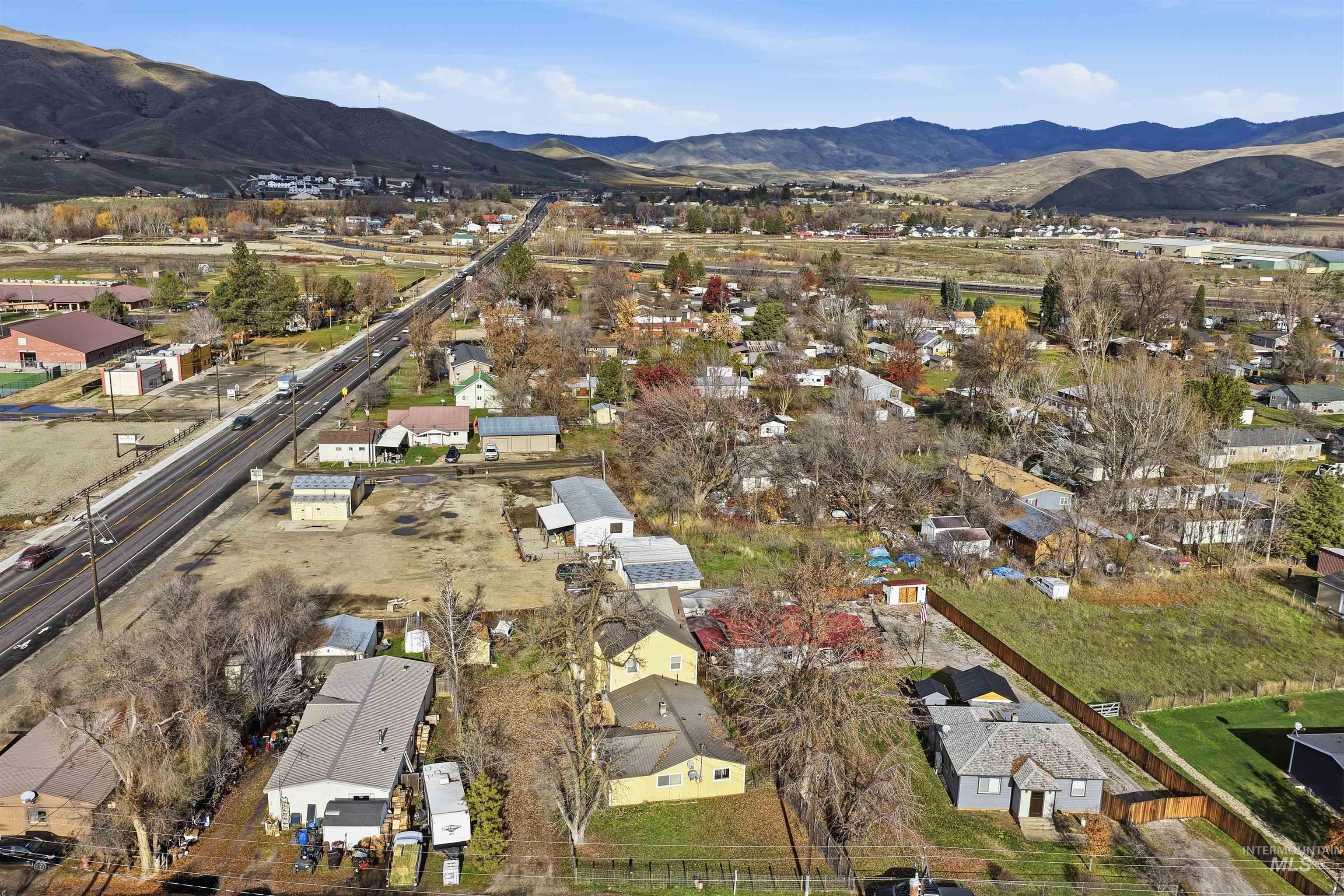 View of property location featuring a mountain backdrop and nearby suburban area