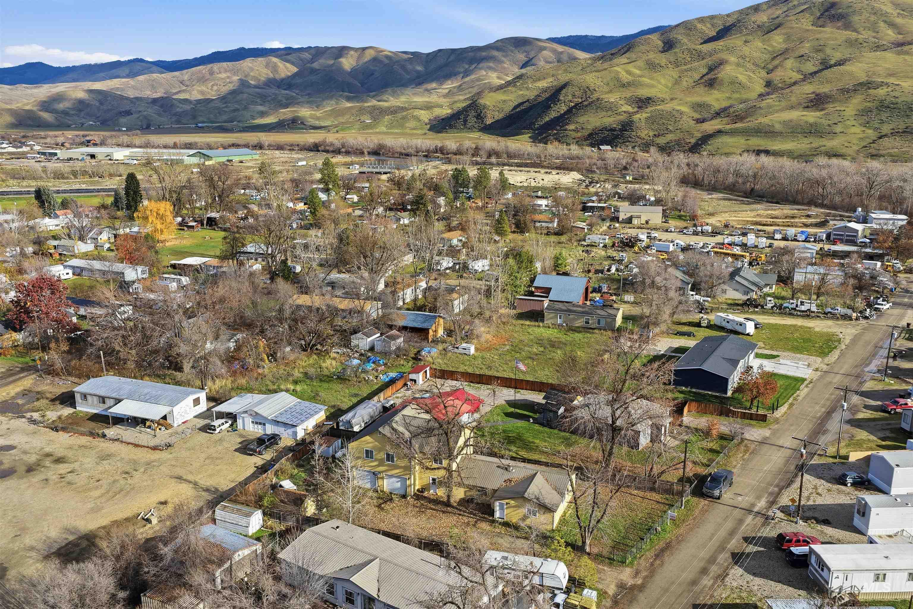 Aerial overview of property's location featuring nearby suburban area