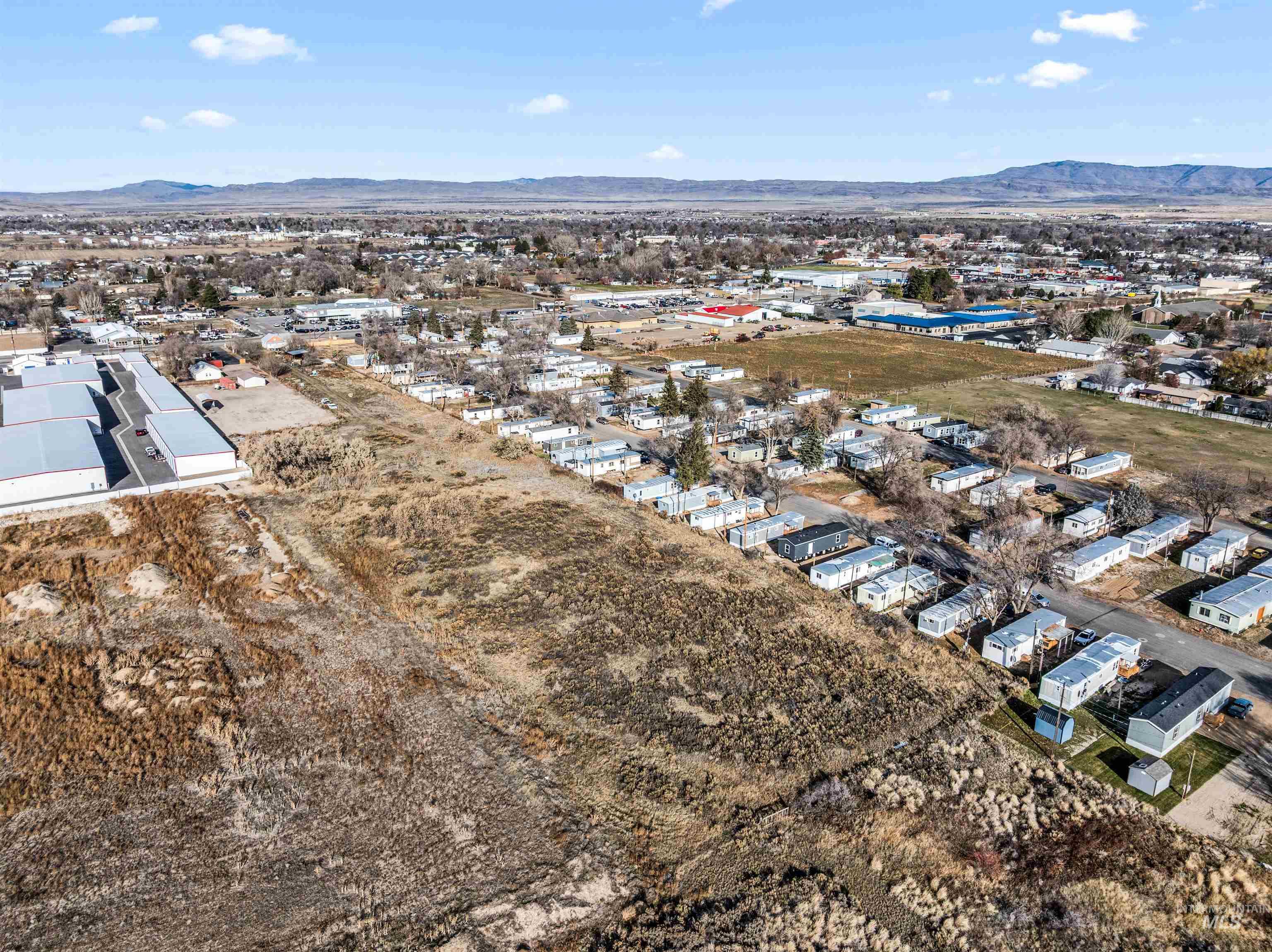 Aerial perspective of suburban area with a mountainous background