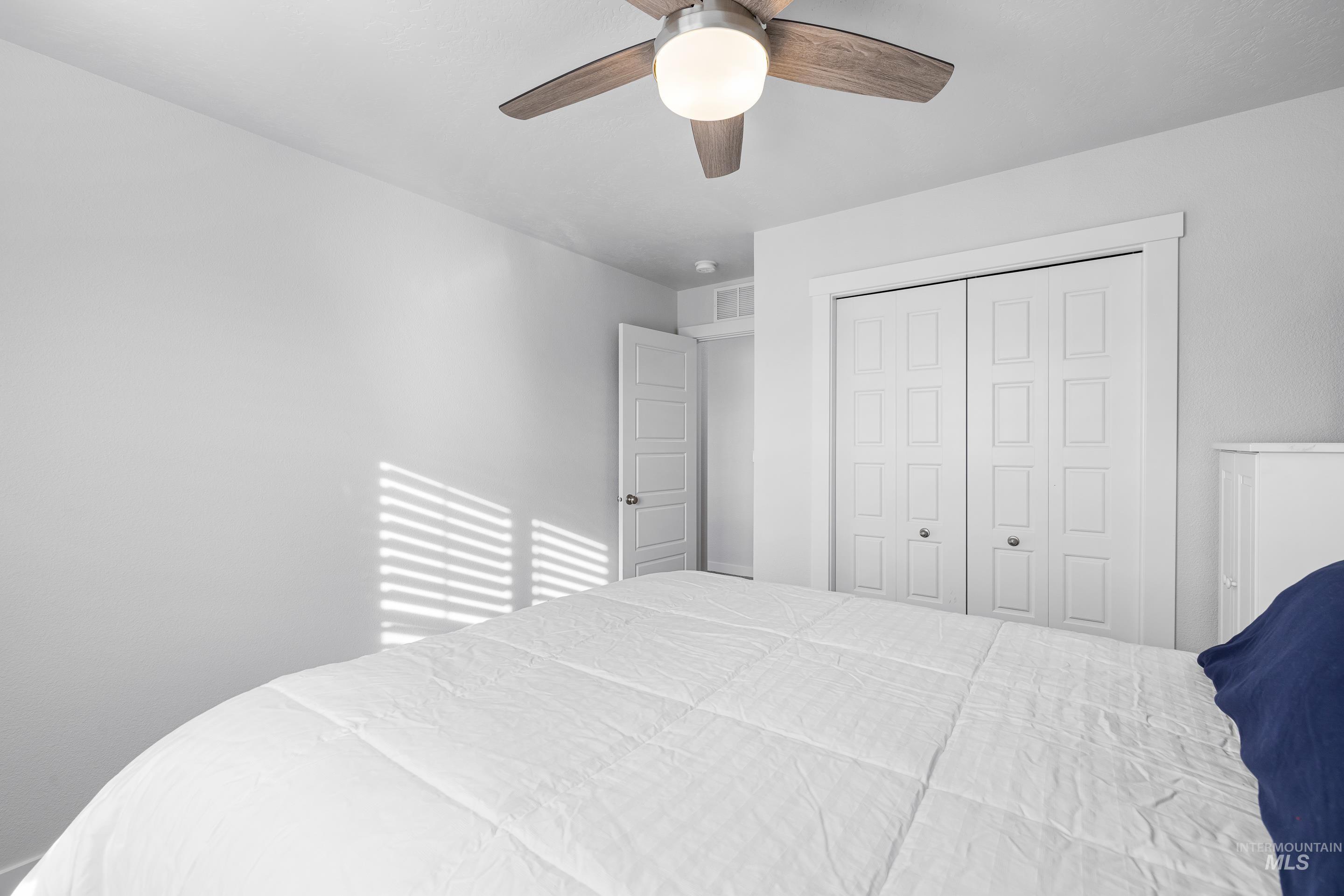 Bedroom featuring a closet and ceiling fan