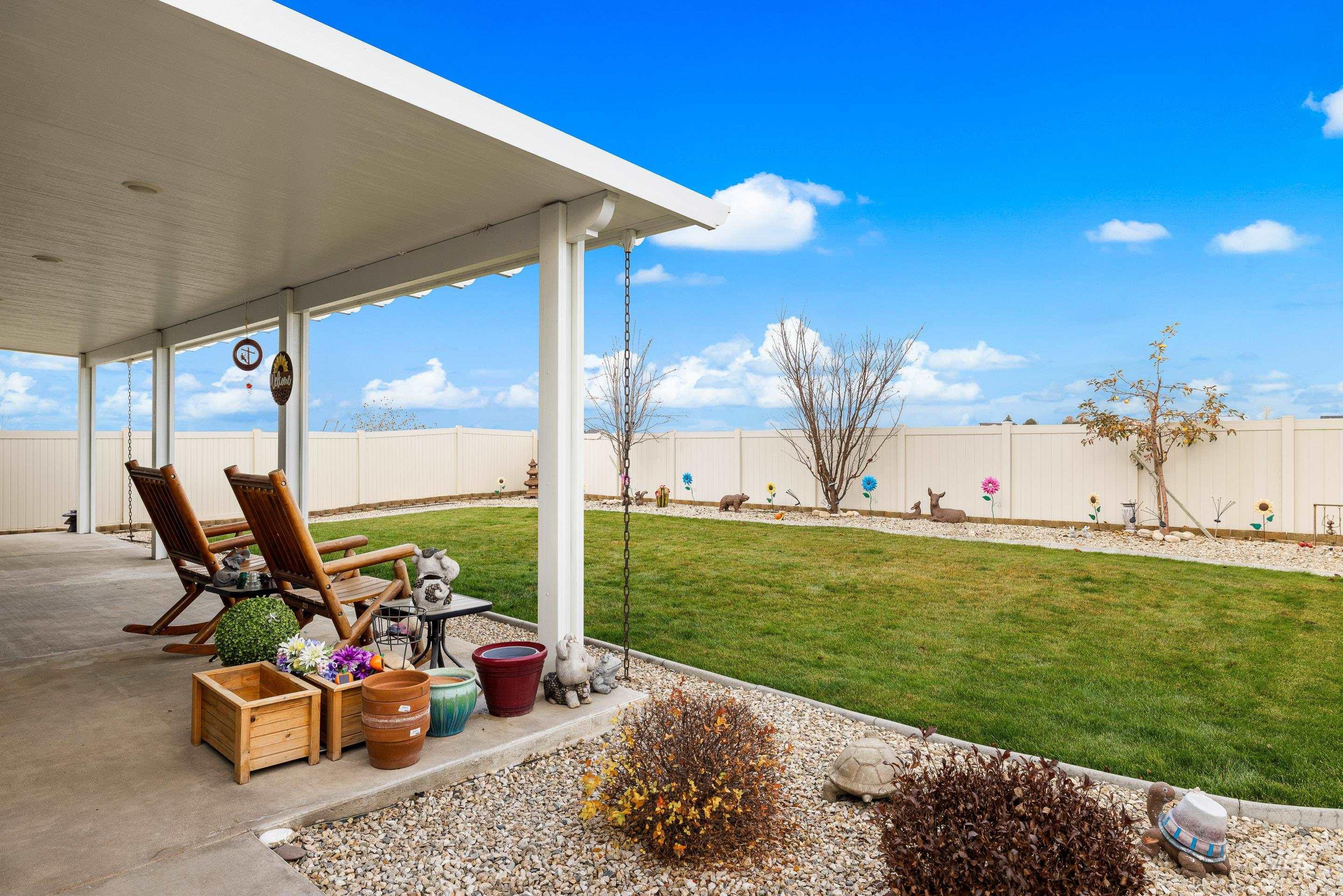 Fenced backyard with a patio
