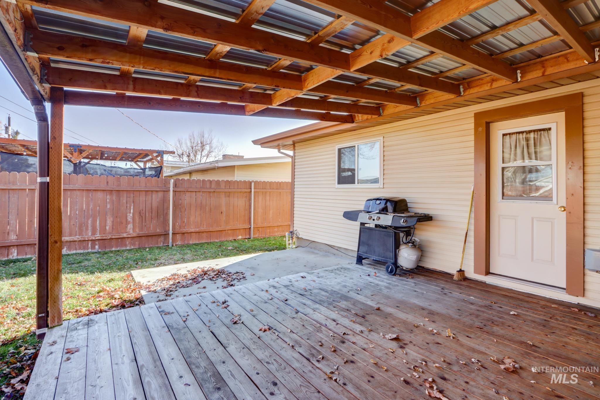 Wooden deck featuring grilling area
