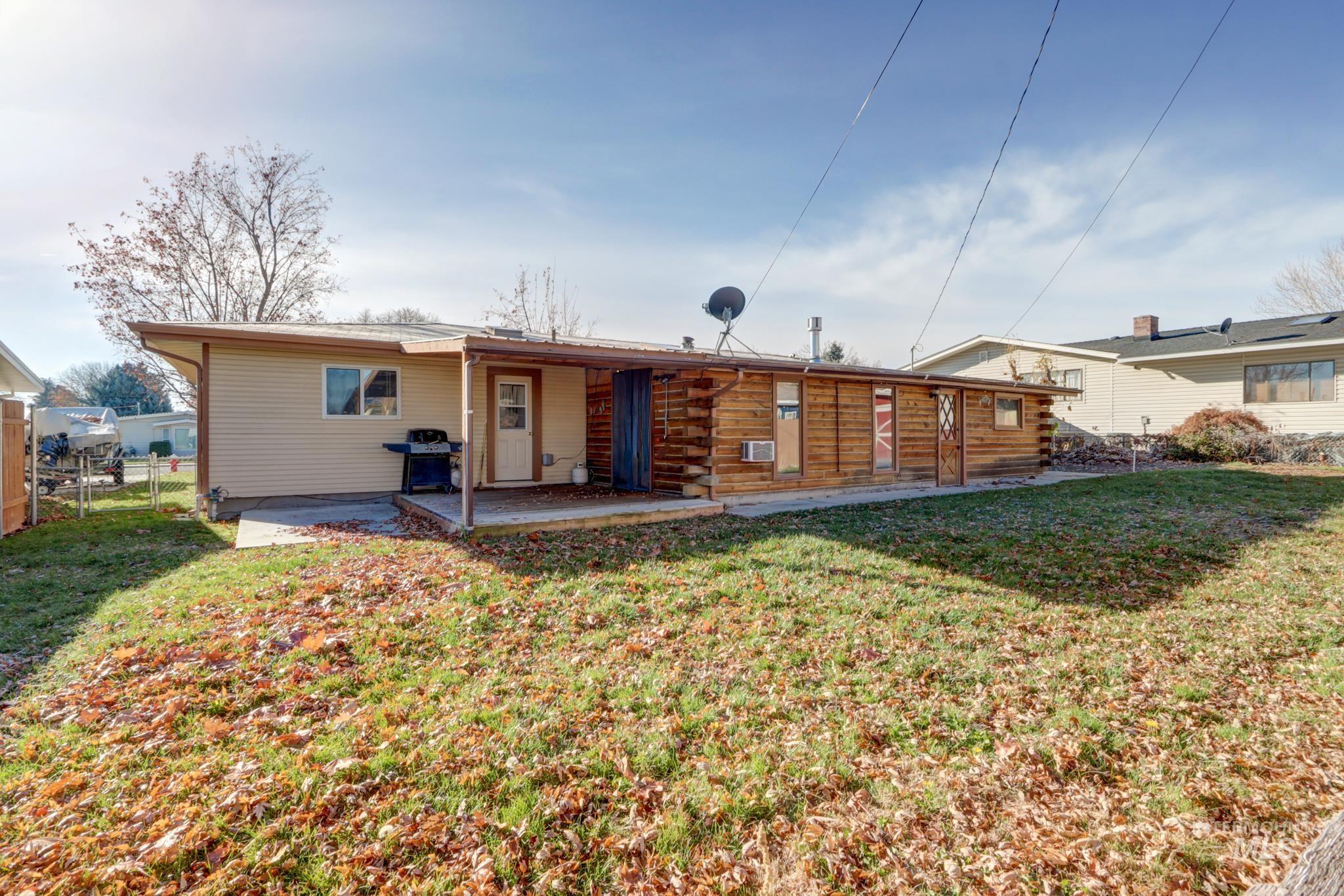 Rear view of property with a patio area and log siding