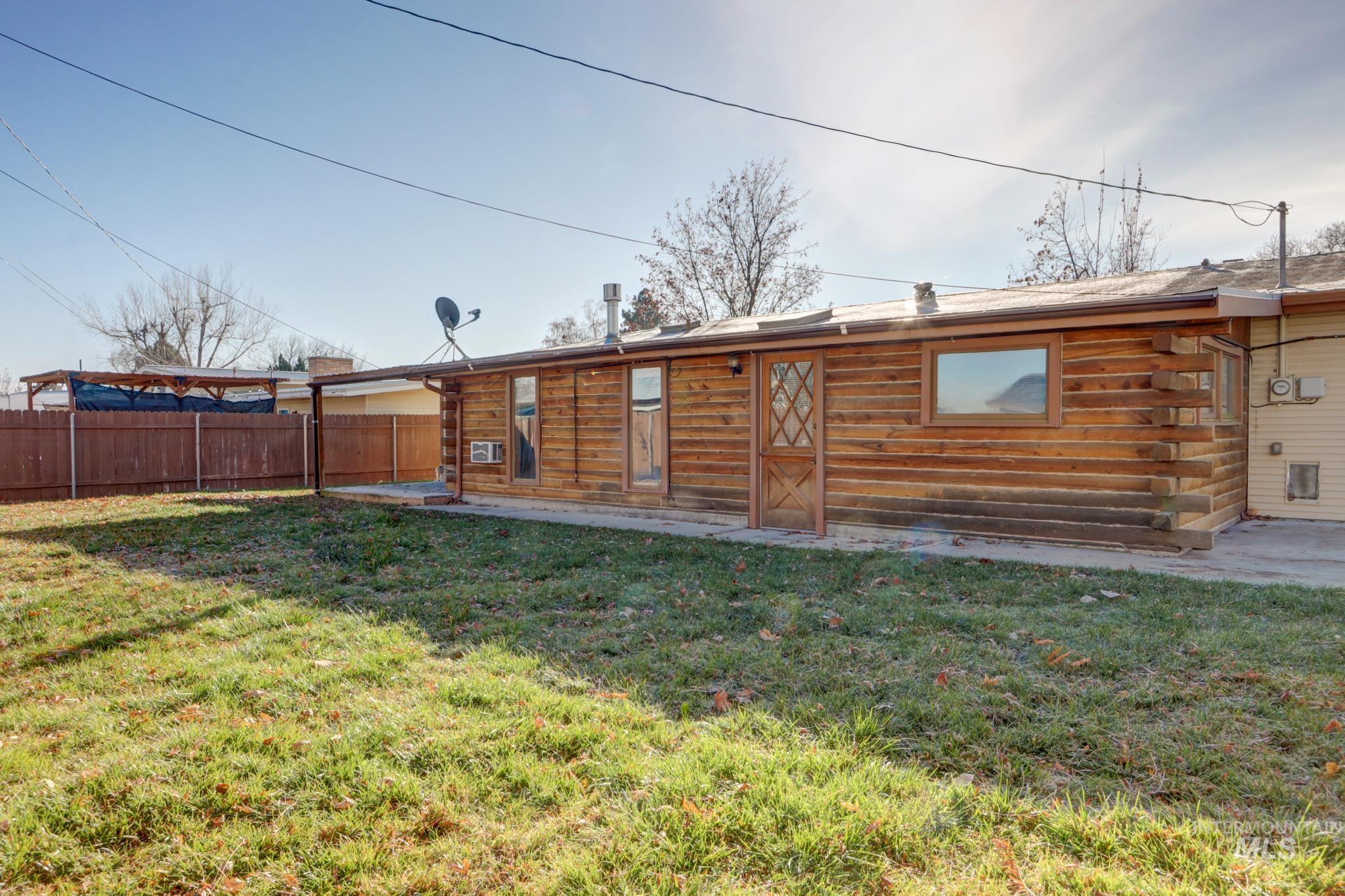 Rear view of property featuring a patio area