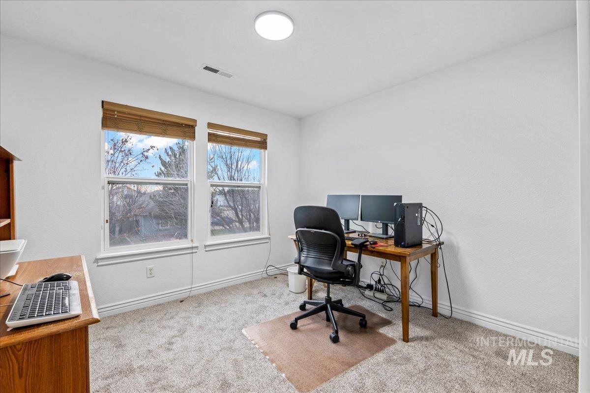 Office with light colored carpet