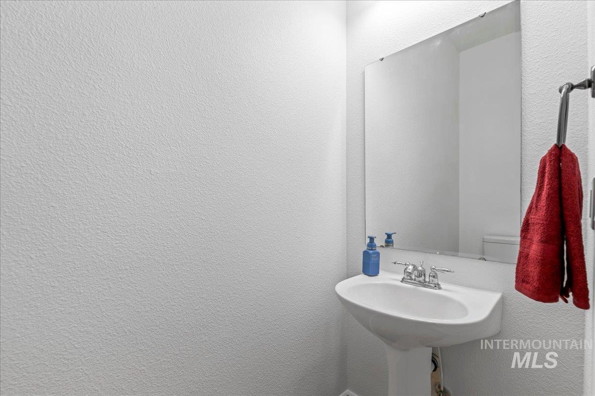 Bathroom featuring a textured wall