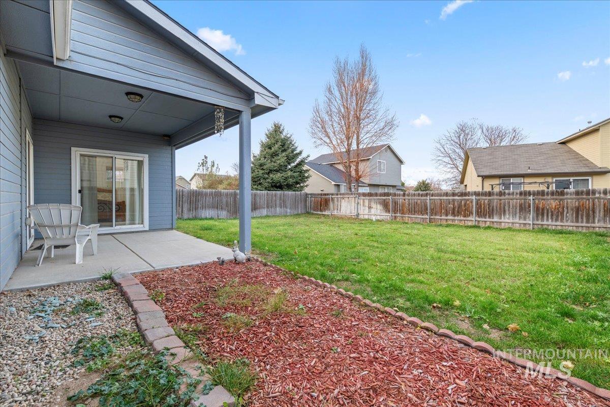 Fenced backyard featuring a patio area