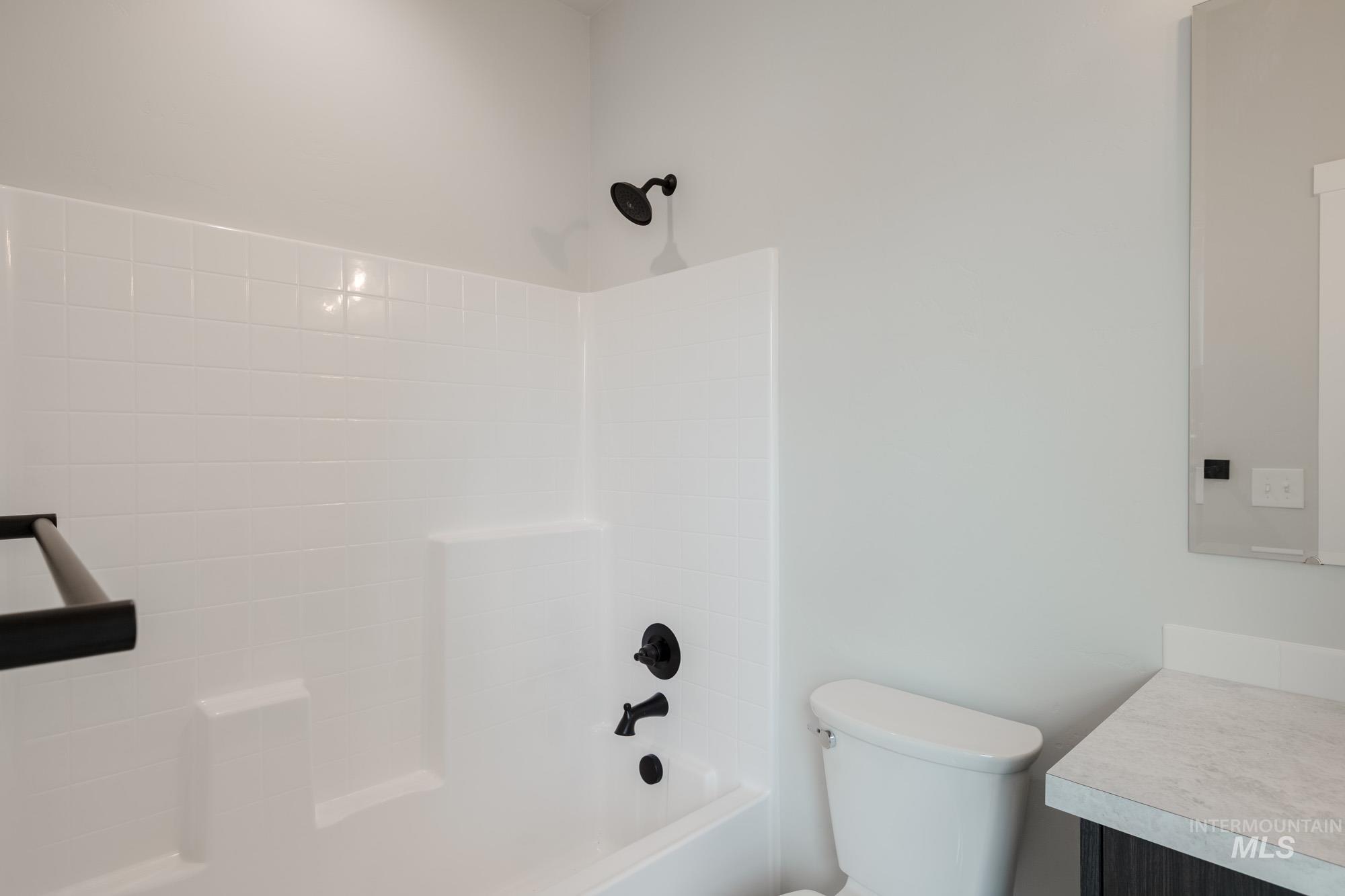 Full bathroom featuring vanity and shower / tub combination