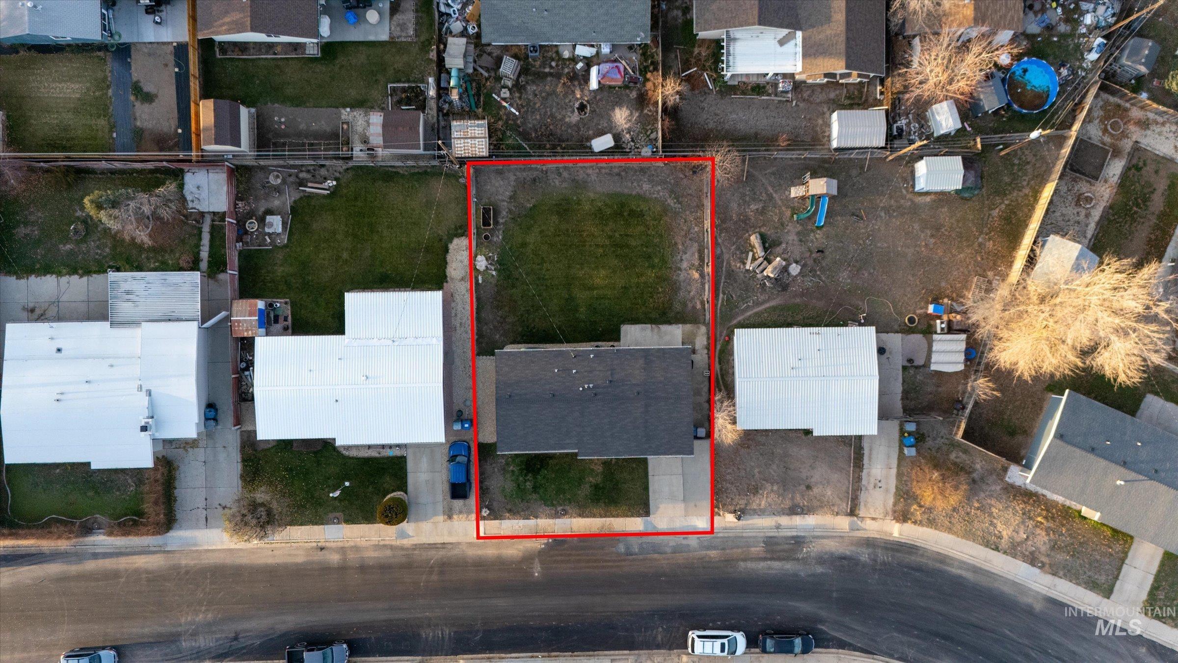 Aerial perspective of suburban area with property parcel outlined