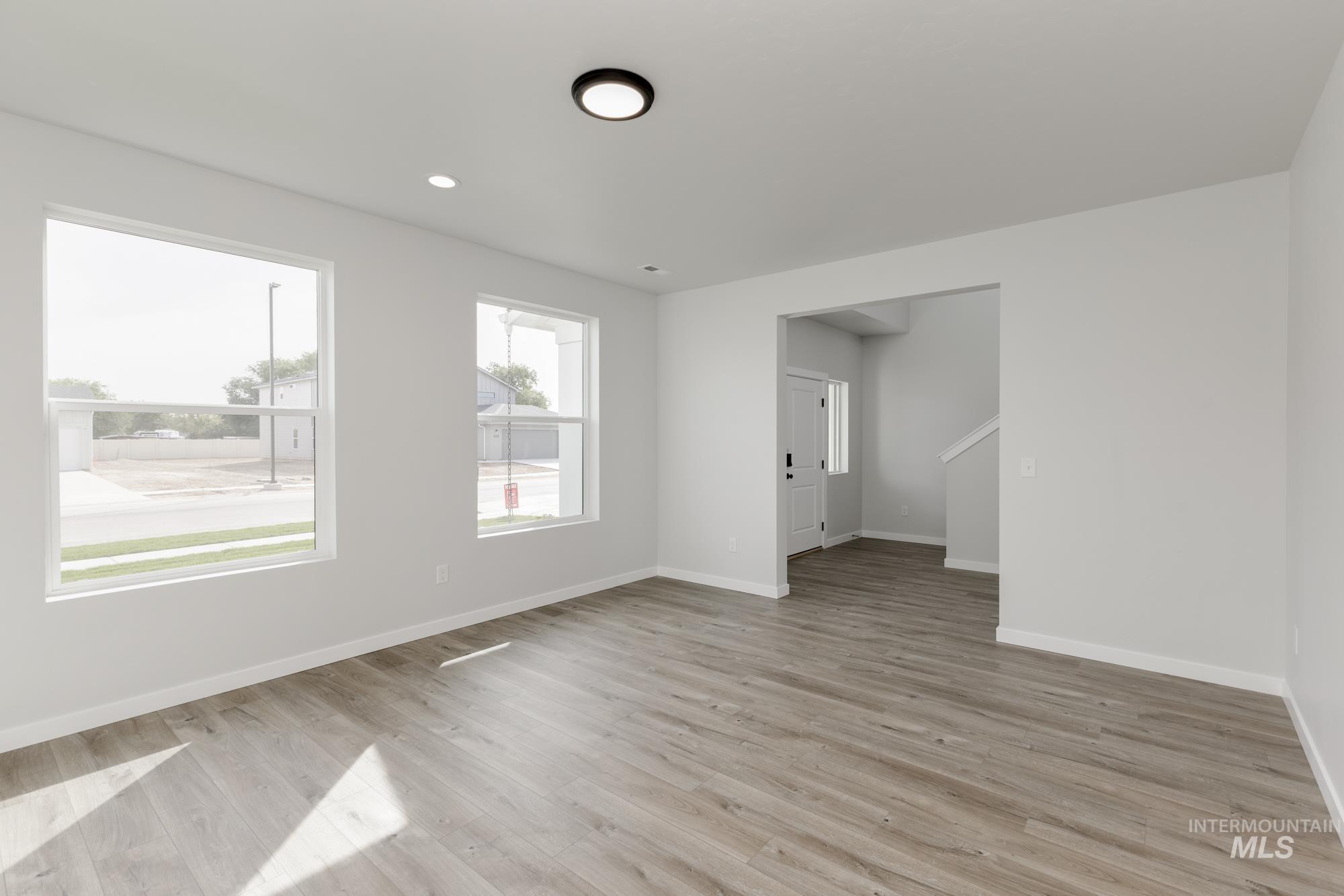 Spare room with light wood-style flooring and recessed lighting