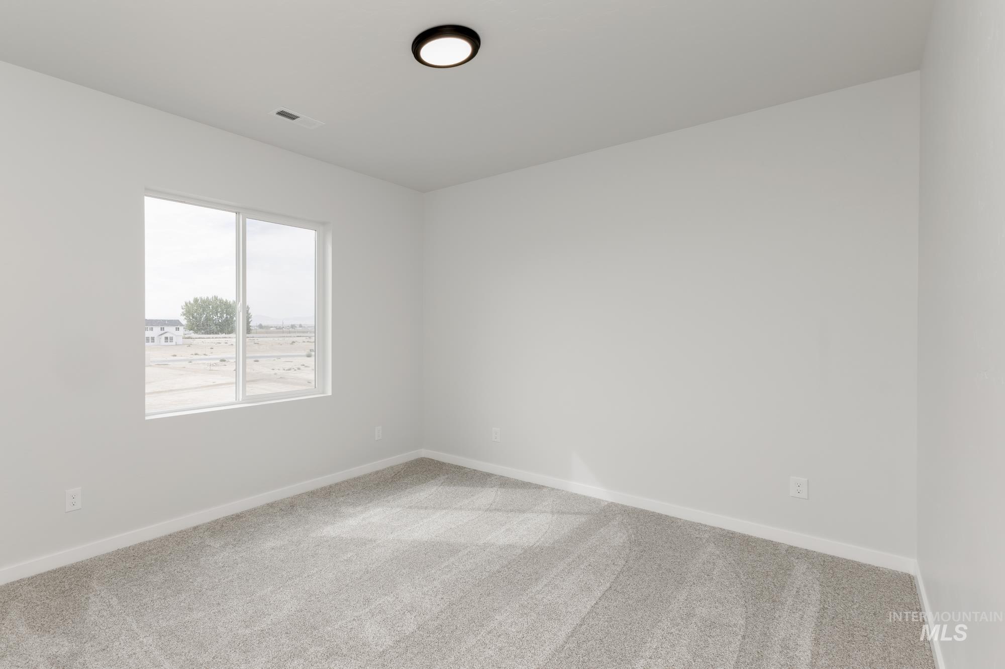 Unfurnished room featuring carpet flooring and baseboards