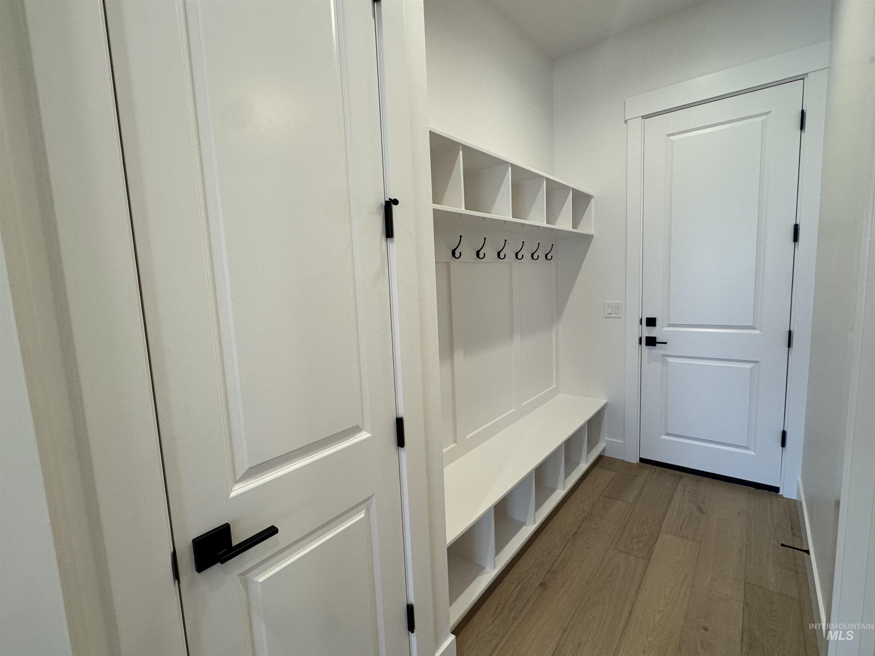Mudroom featuring light wood-style floors