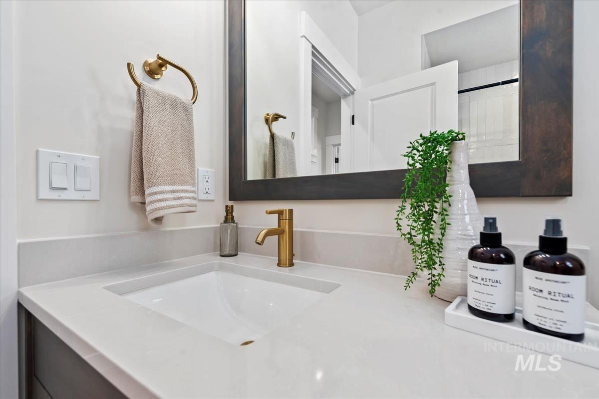 Full bathroom with vanity and a shower with shower curtain