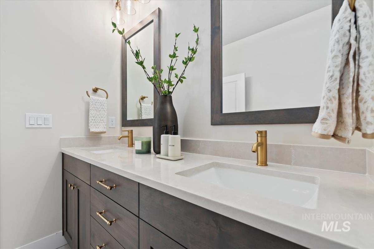 Full bathroom featuring double vanity