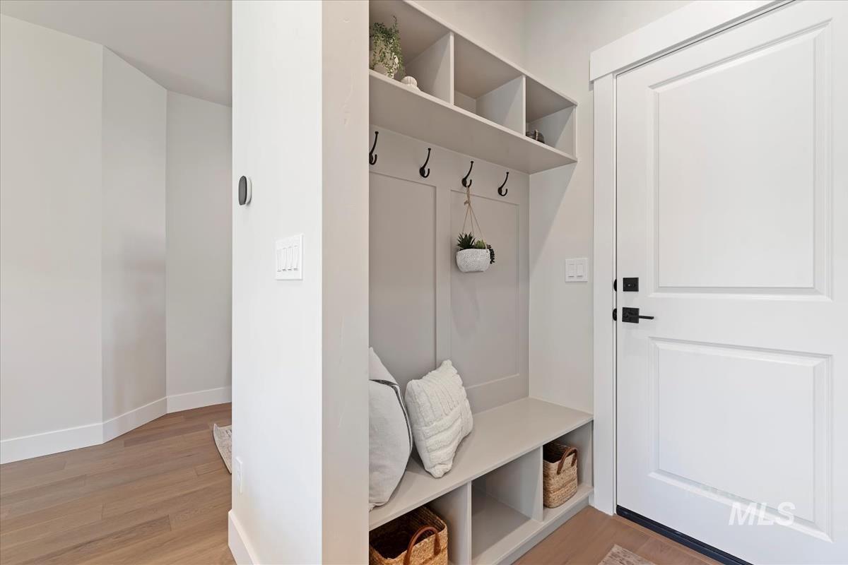 Mudroom featuring light wood-style floors